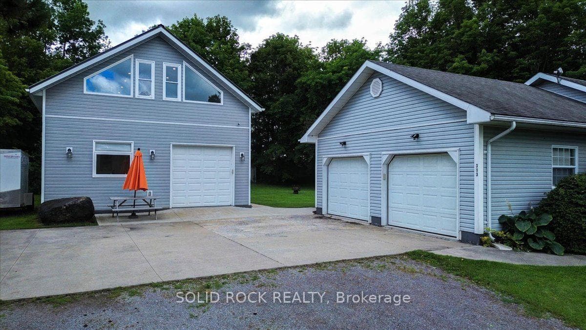 Attached 2 Car Garage/Detached 1 Car Garage + Loft