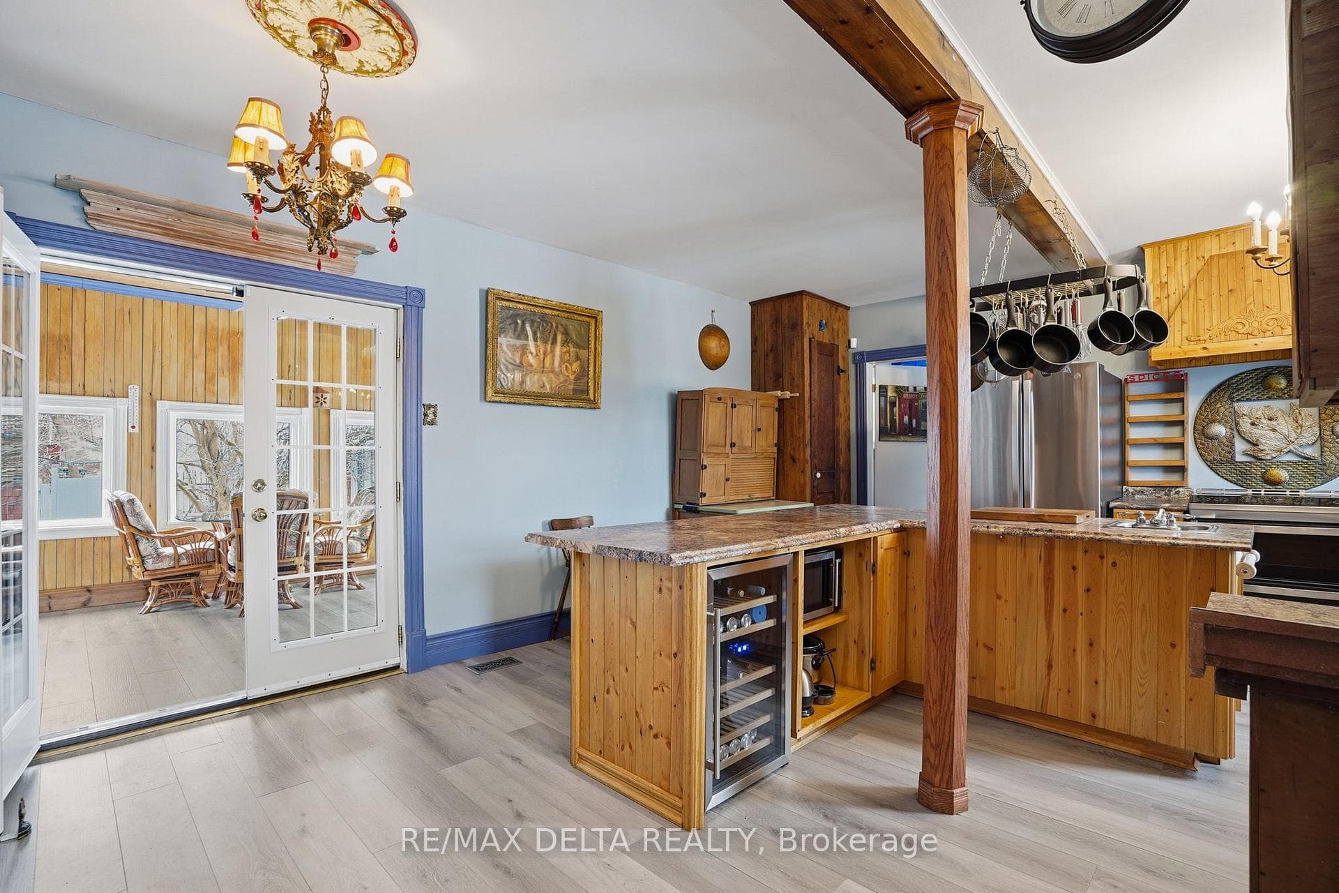 Kitchen leads to sun room.