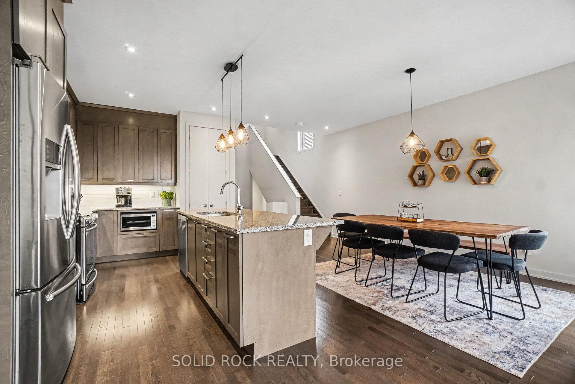 Main floor kitchen with island & dining area