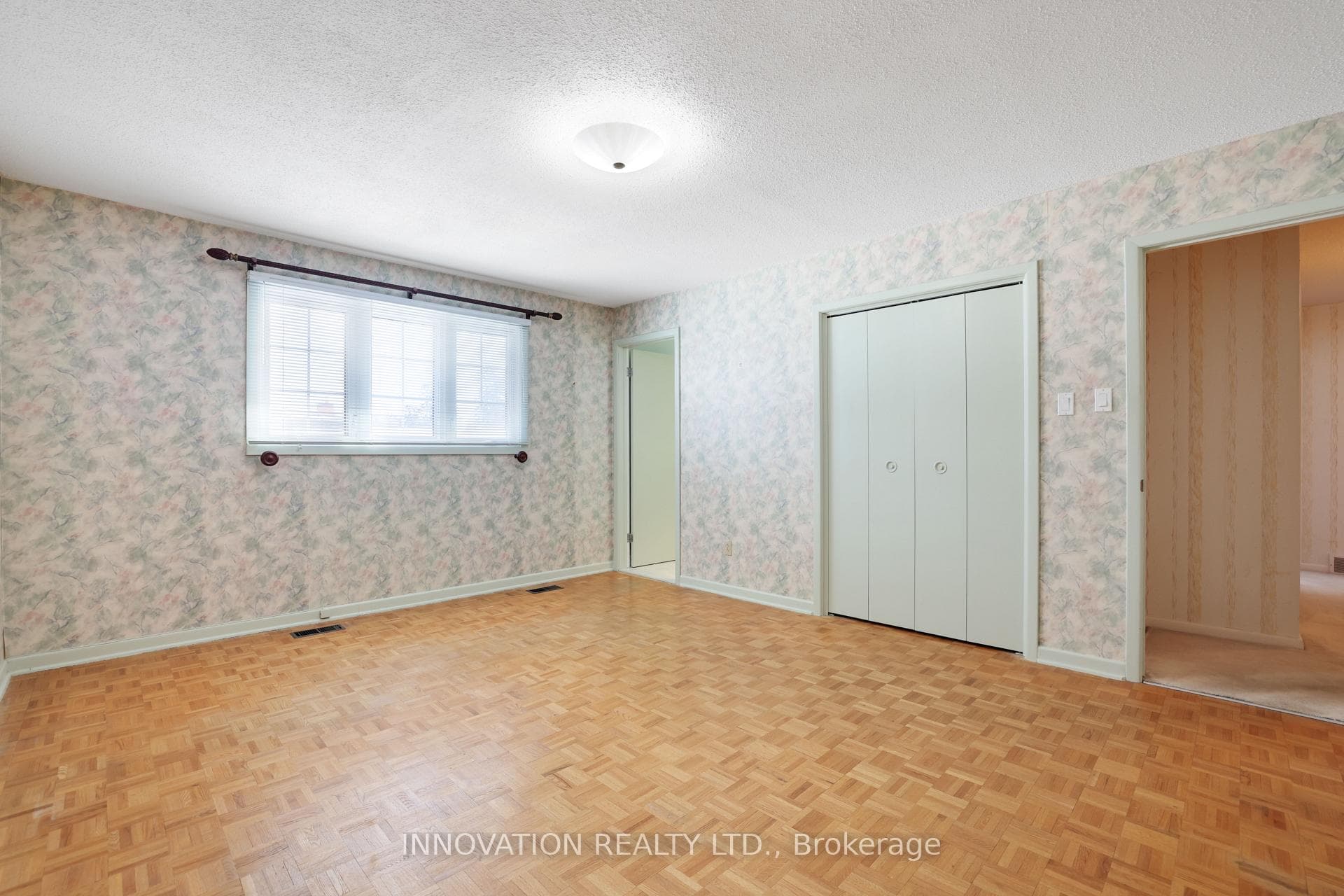 Primary bedroom with walk-in closet