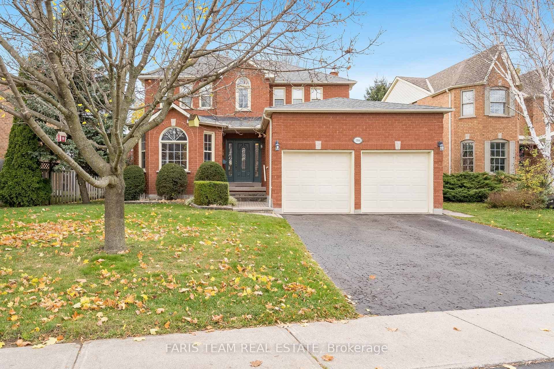 Front of property featuring a front yard & garage
