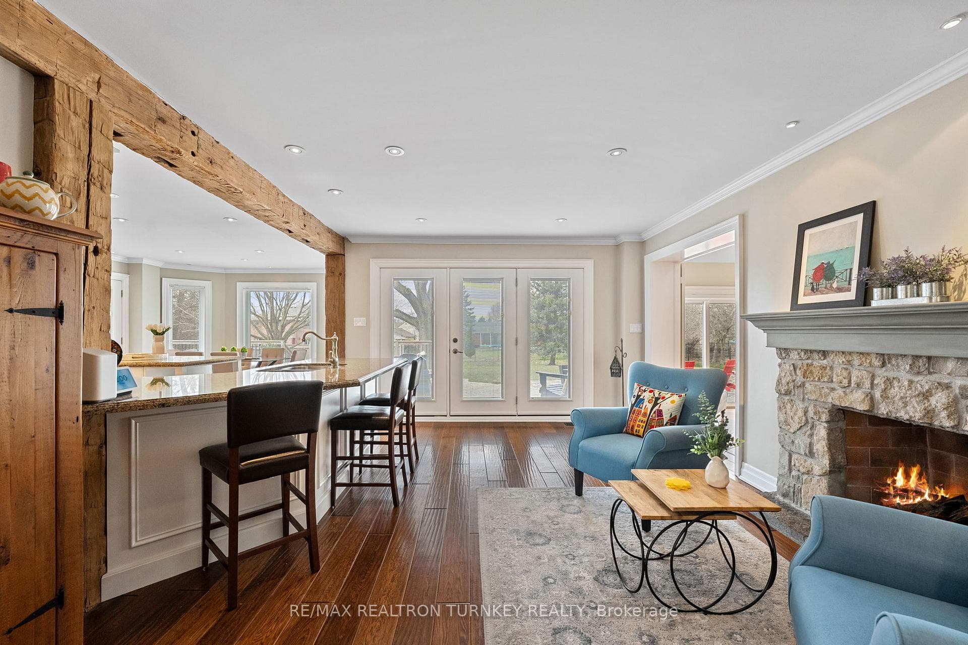 Flows into the cozy Sitting room w/ Fireplace