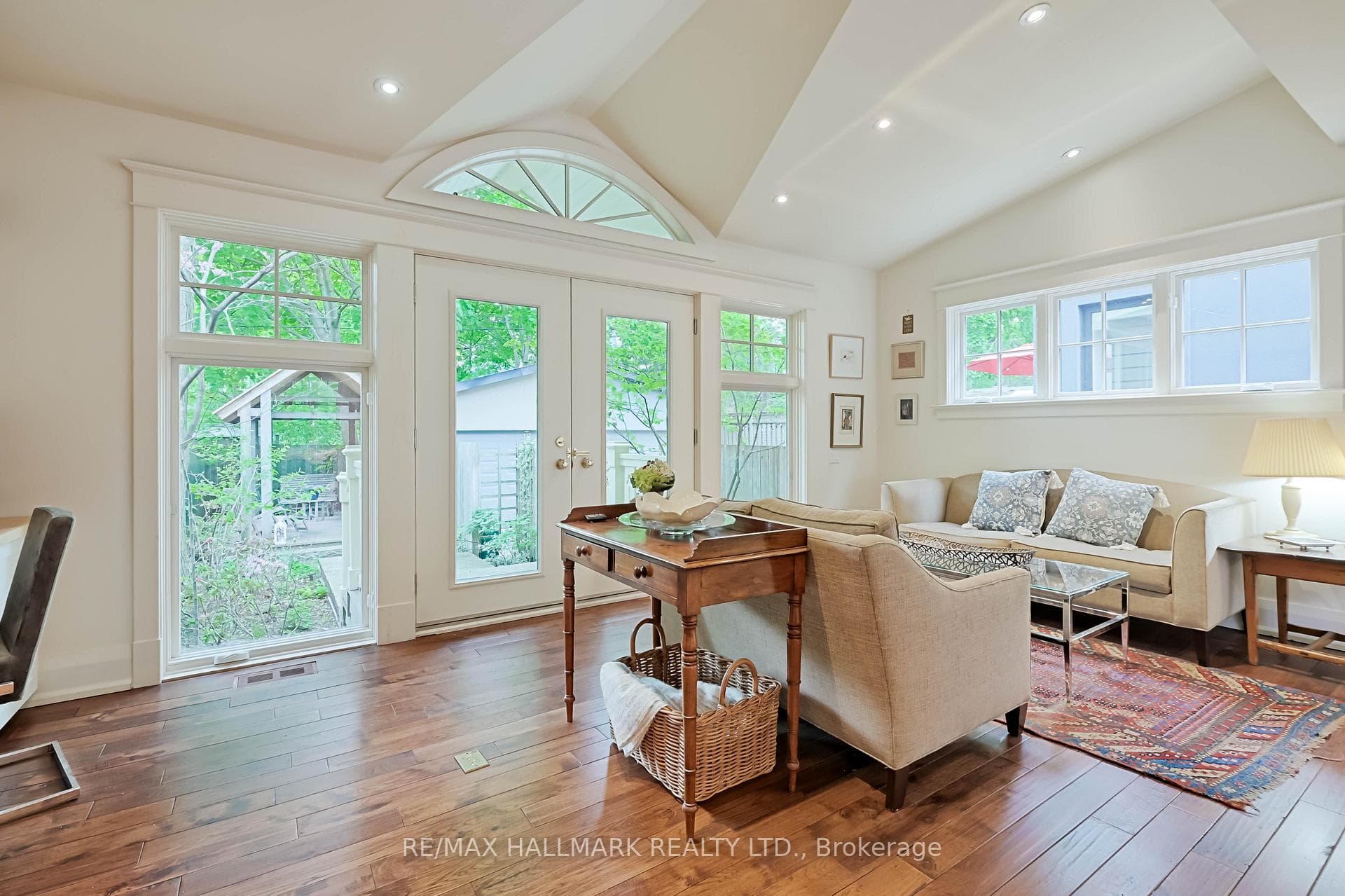 Family room wall of windows and Palladian accent