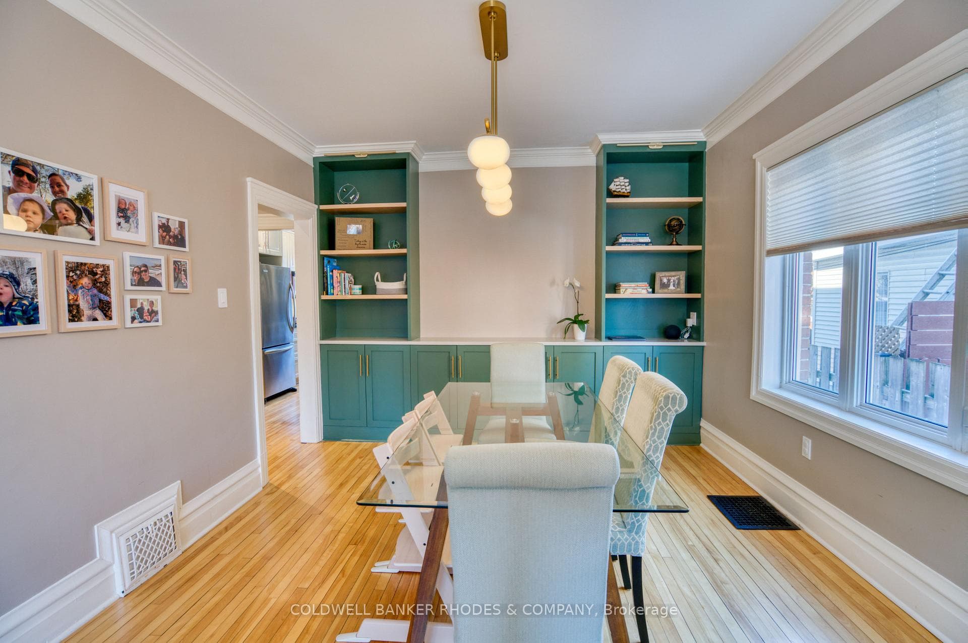 Custom built-in bookshelves elevate the dining rm