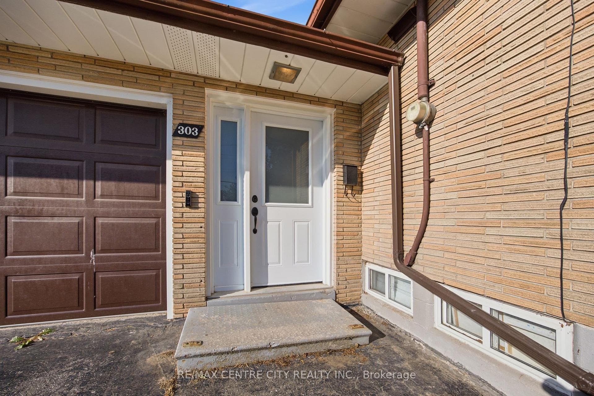 Breezeway Leading to Garage House and Backyard