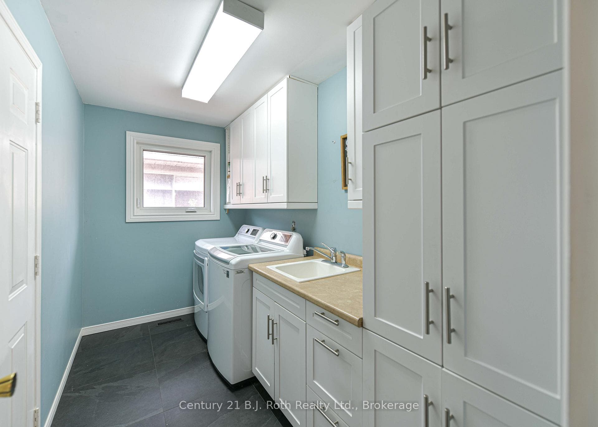 Main floor laundry with entry from garage