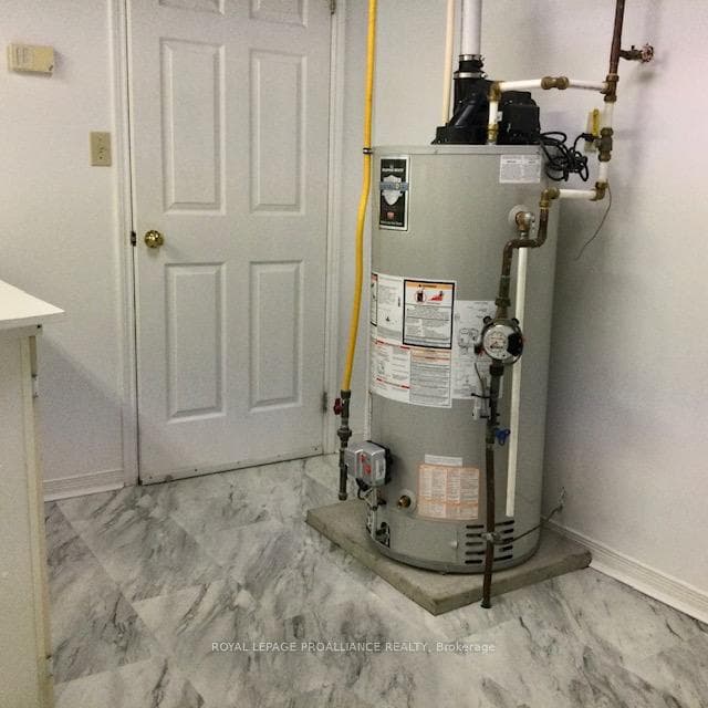 laundry room with NG water heater
