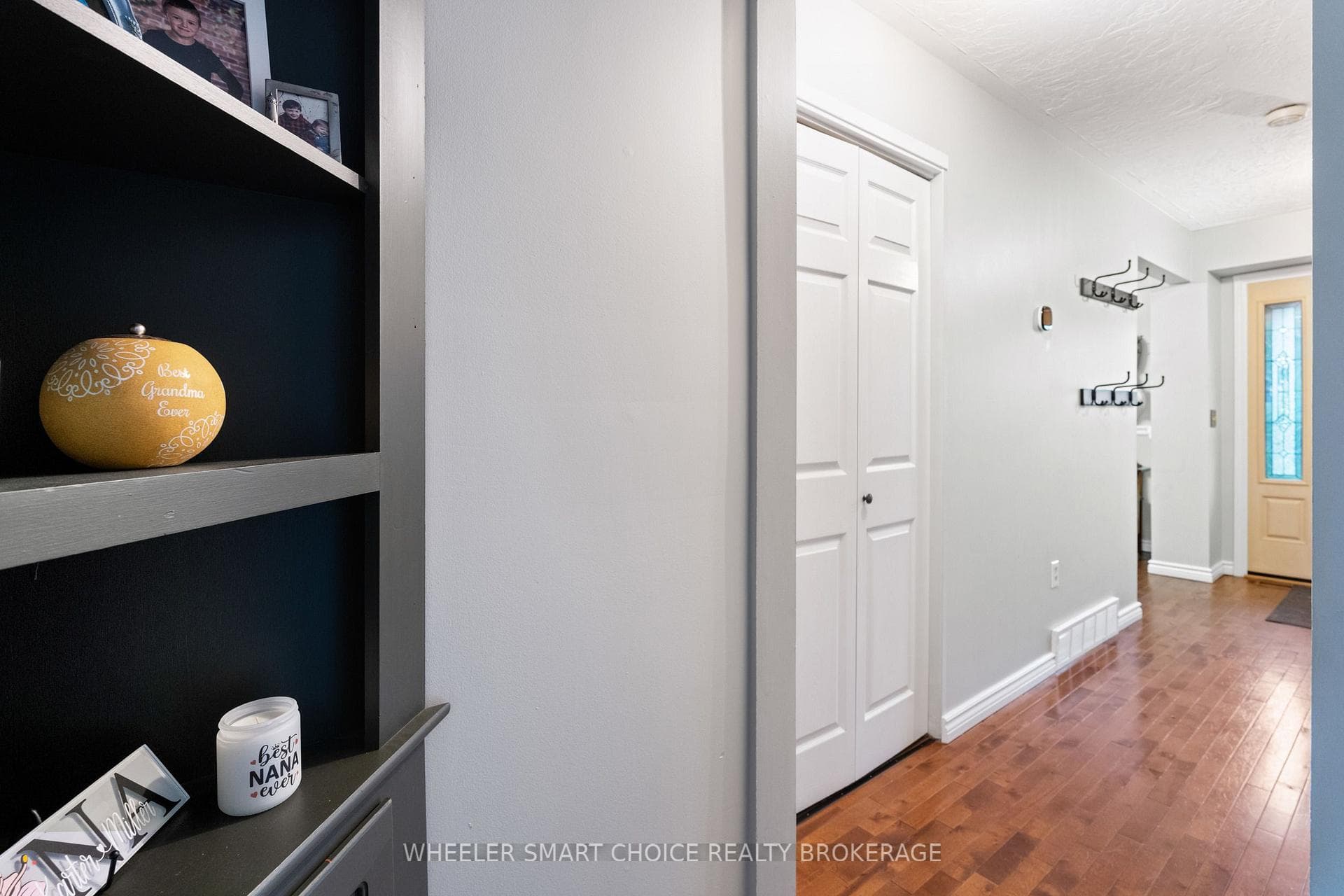 The hallway with a unique pass-though front closet