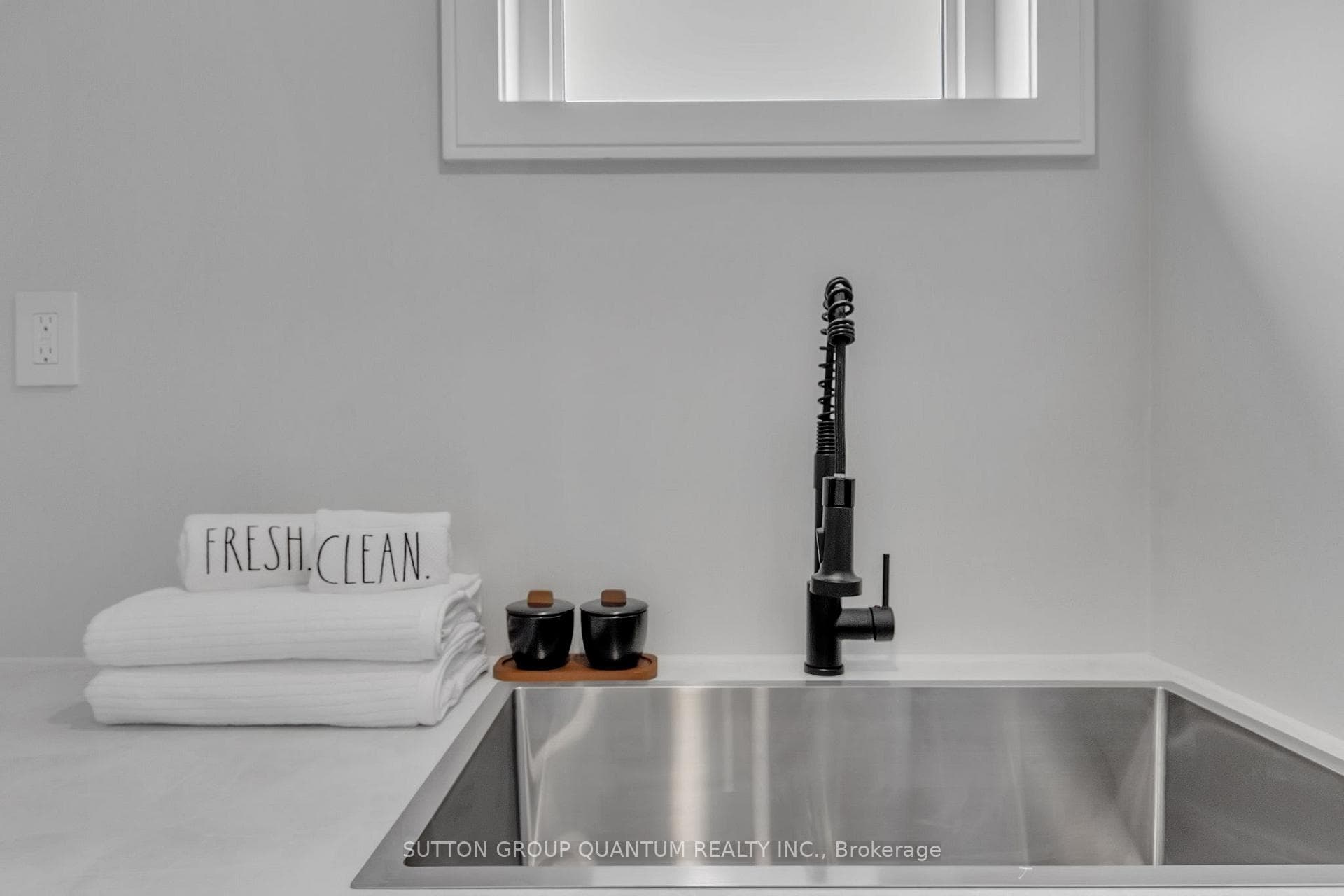 Quartz countertops with large sink, faucet