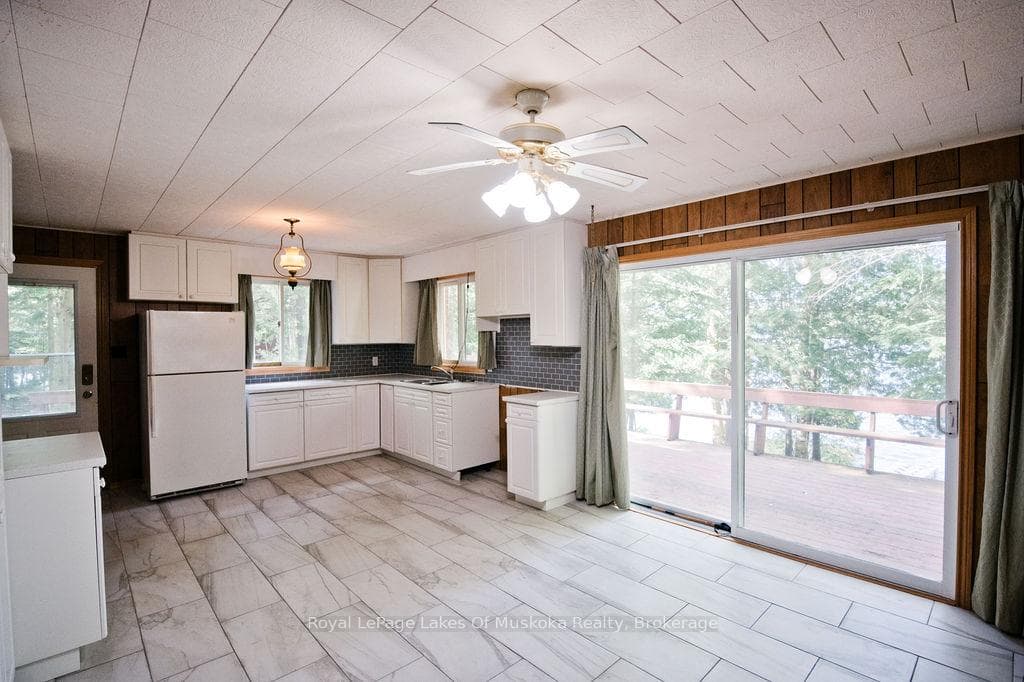 Kitchen Features W/O to BBQ Deck on the Lake Side