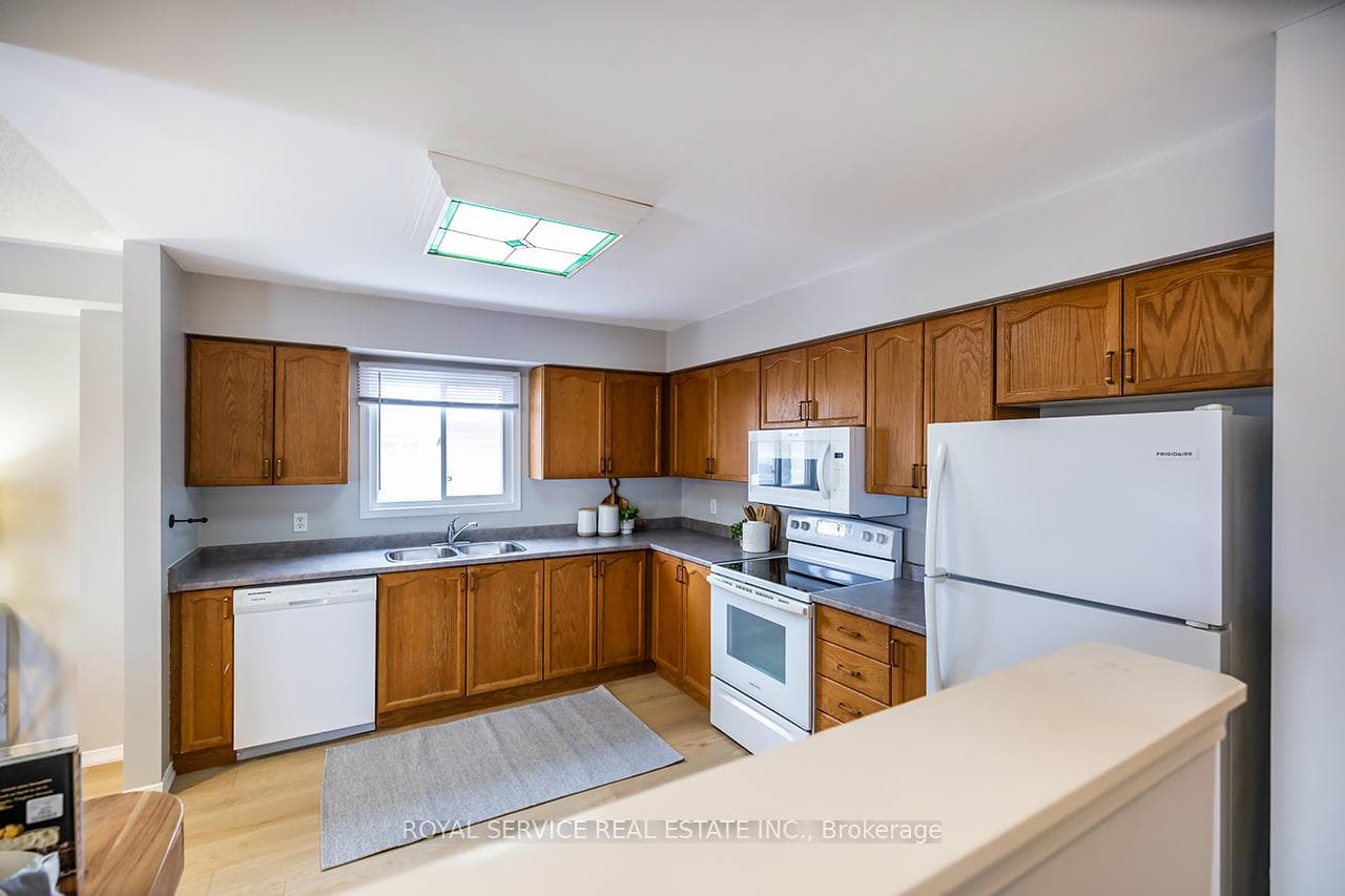 Kitchen with B/I microwave.