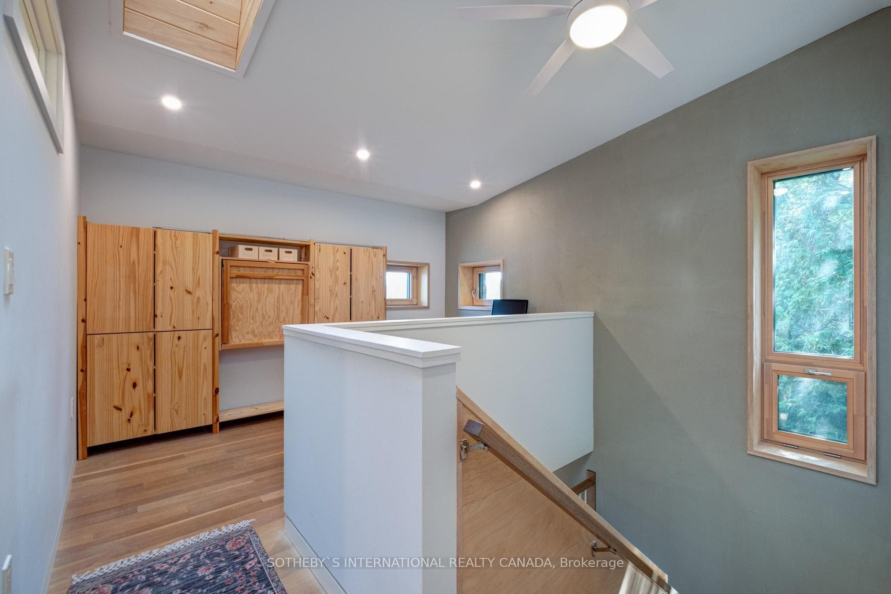 2nd floor office with built in desk/shelving