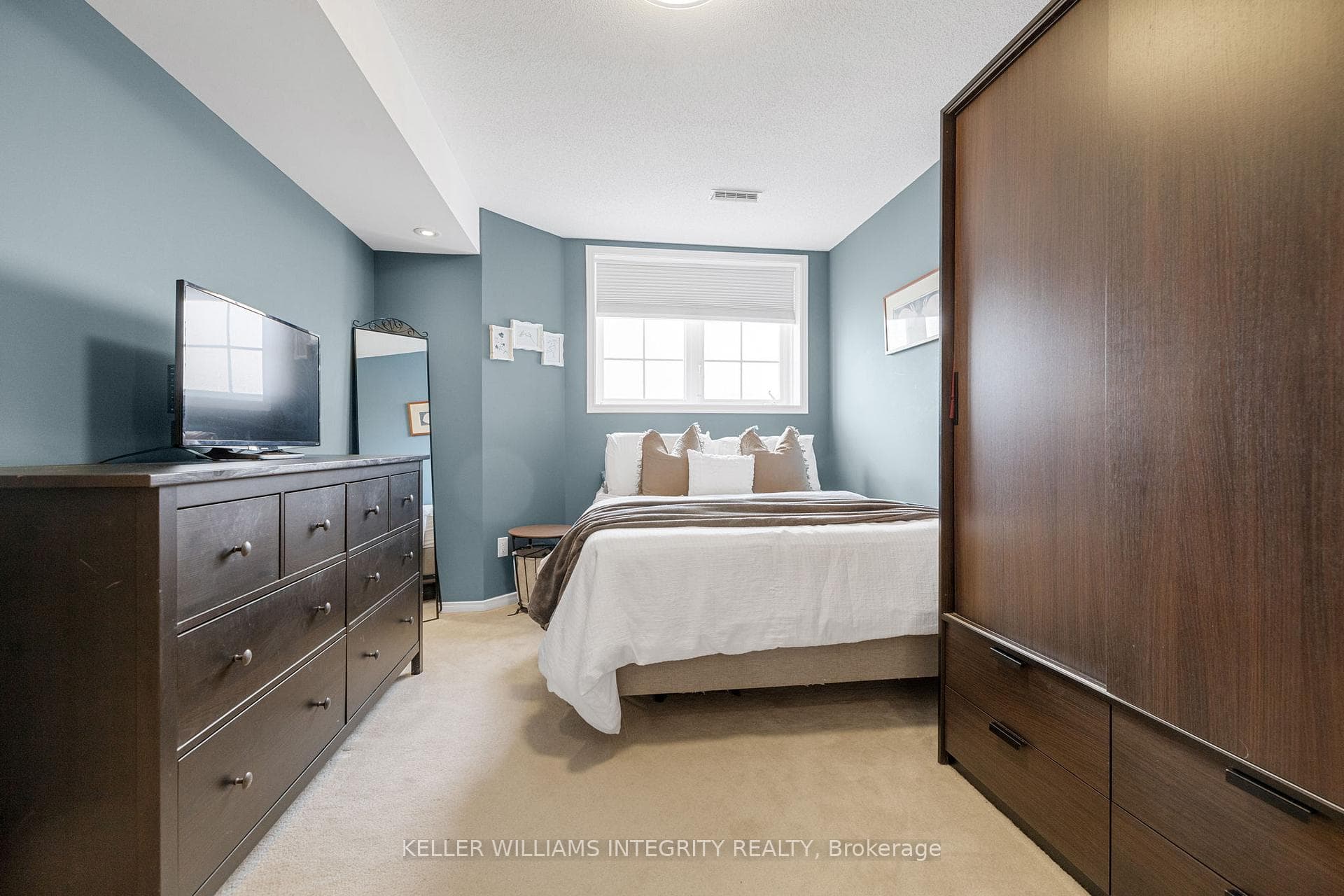 Second bedroom with large bright window