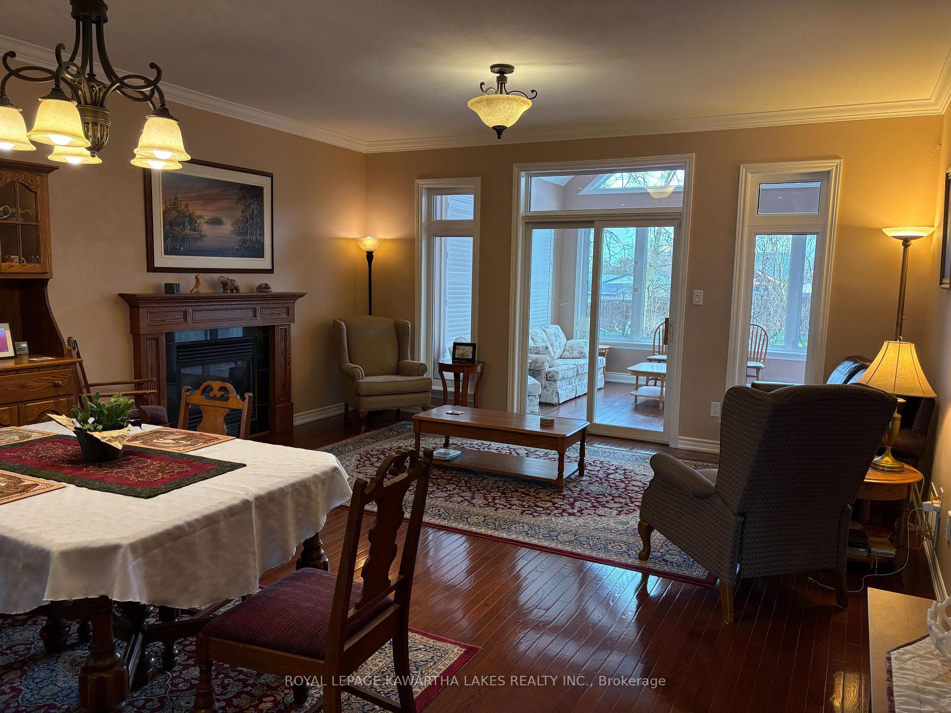 Gas fireplace and sliding doors to sunroom