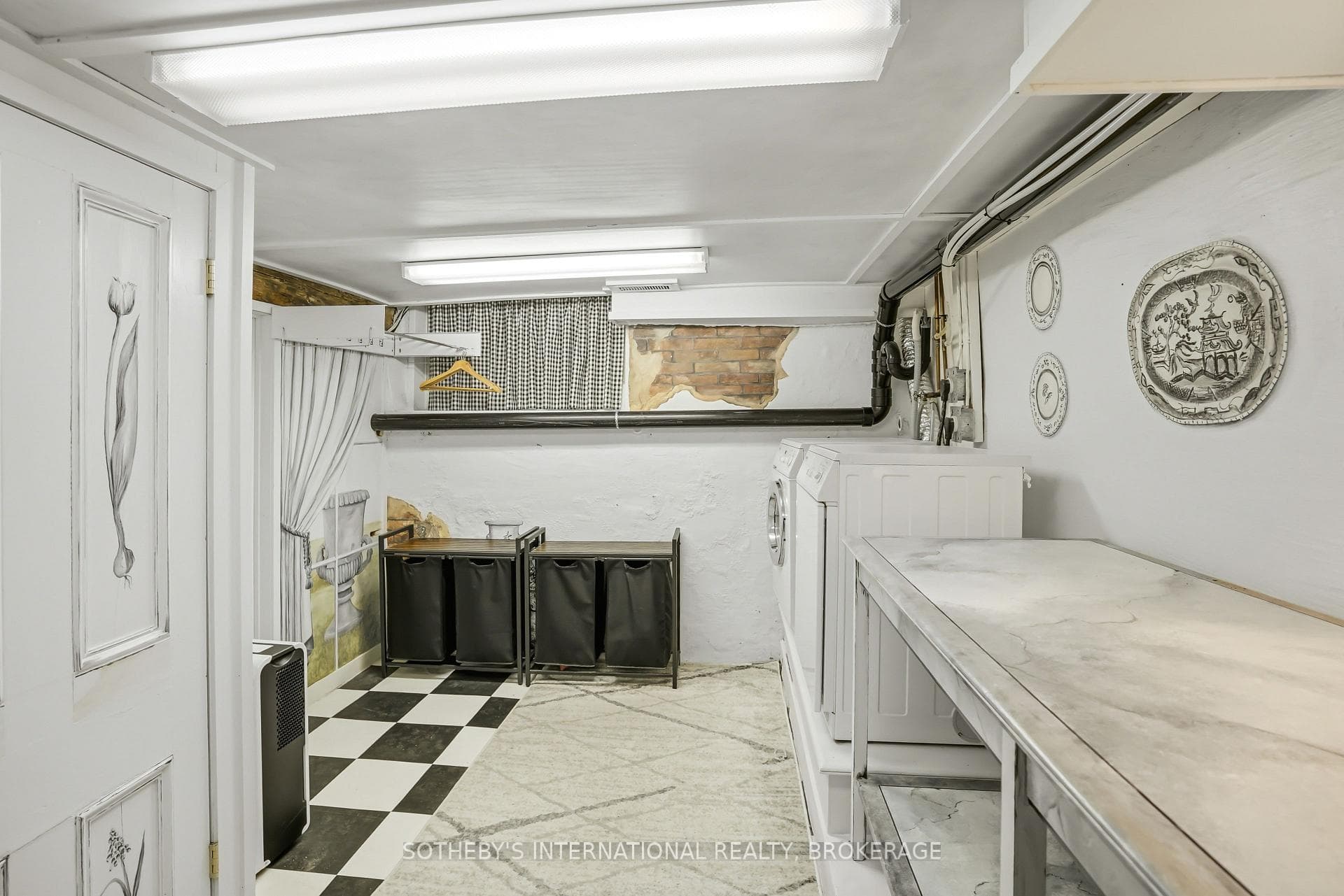 Second laundry with folding table, renovated 2024.