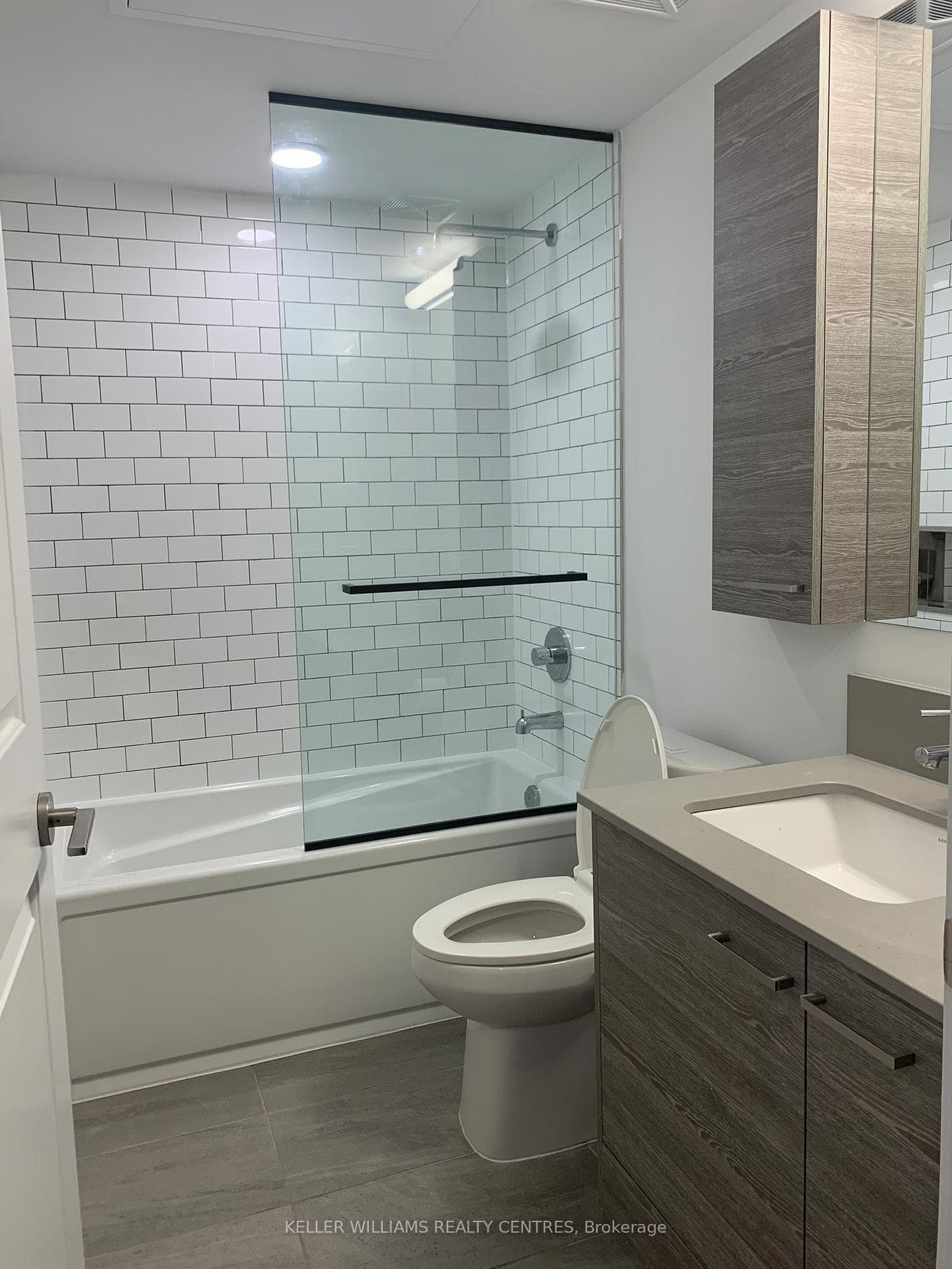 Bathroom with Glass Enclosure and Soaker Tub