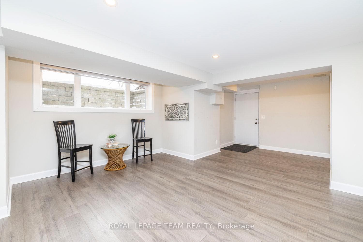 Bright, versatile rec room with access to garage.