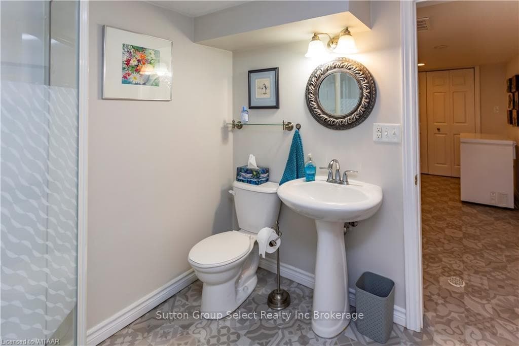 Bathroom featuring tile patterned flooring, sink,