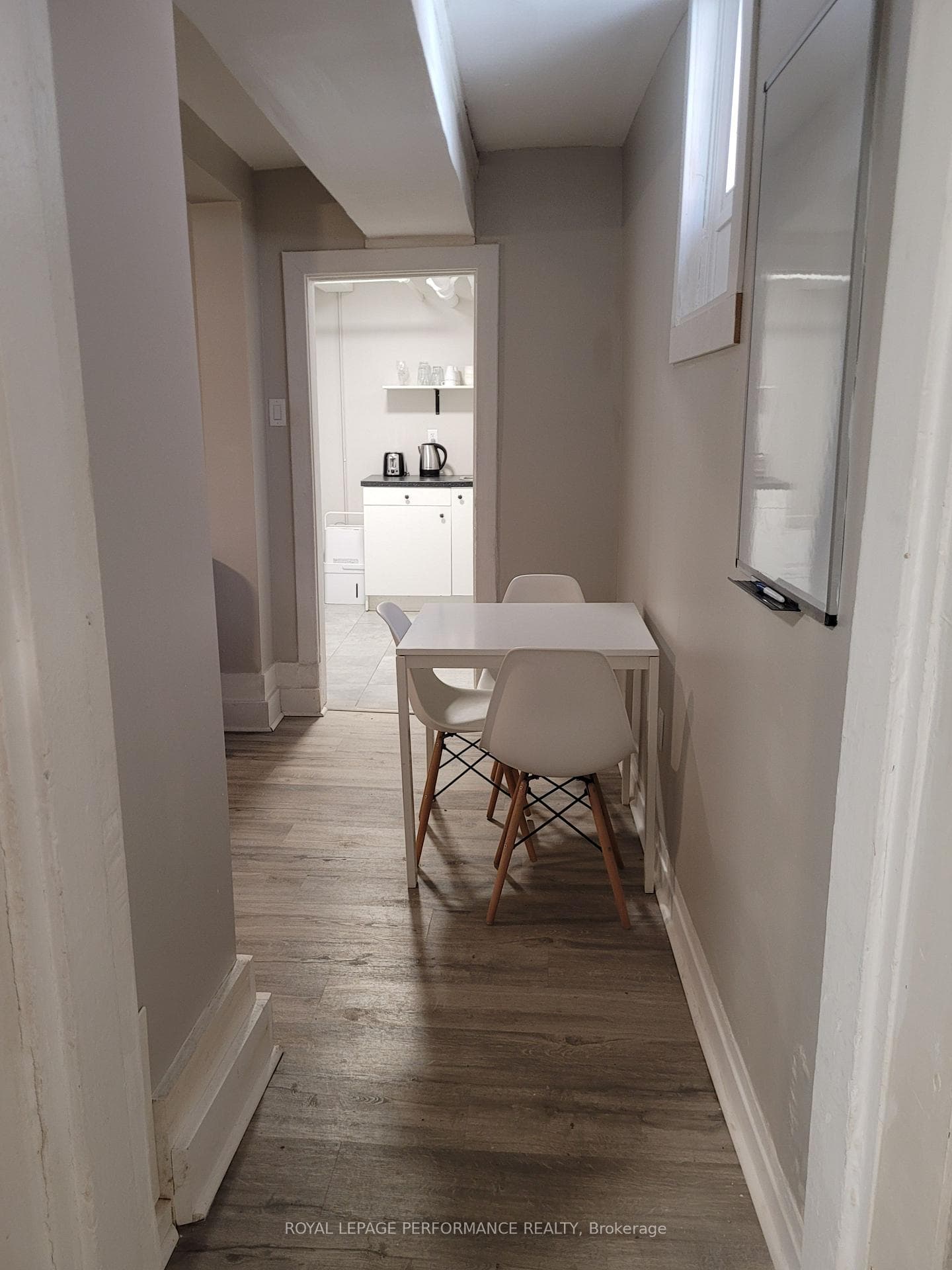 Looking into the unit, dining area and kitchen