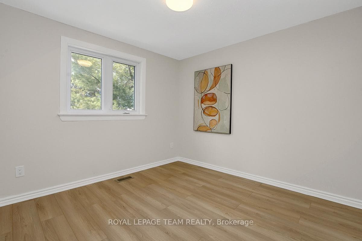 Third bedroom with large window.