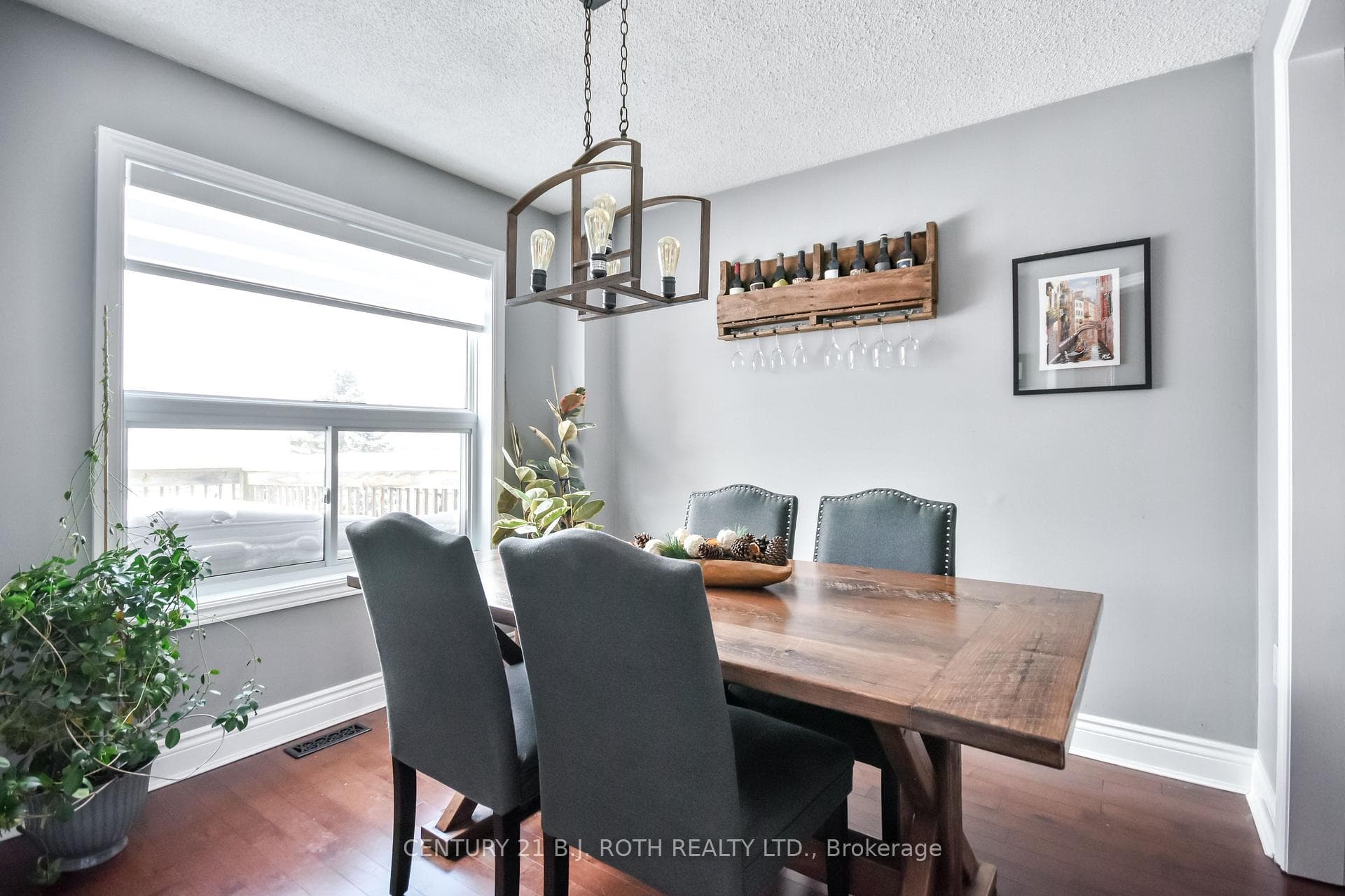 Bright dining room with hardwood floors!
