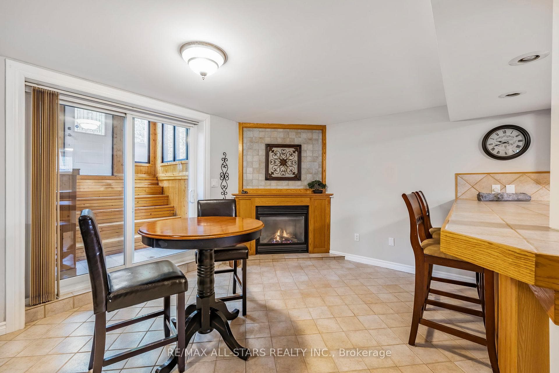 Lower level Dining area w/walk-up to backyard.