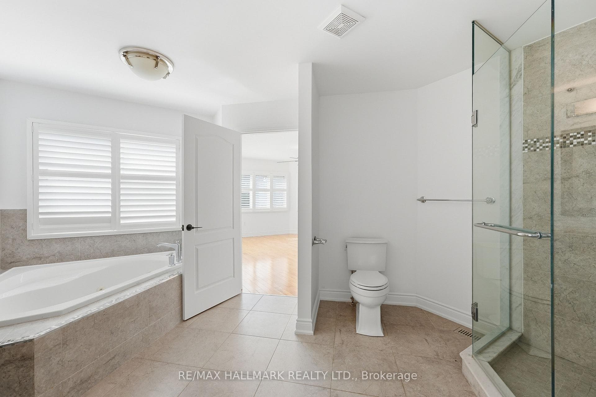 Ensuite Entrance with Standing Shower and Tub