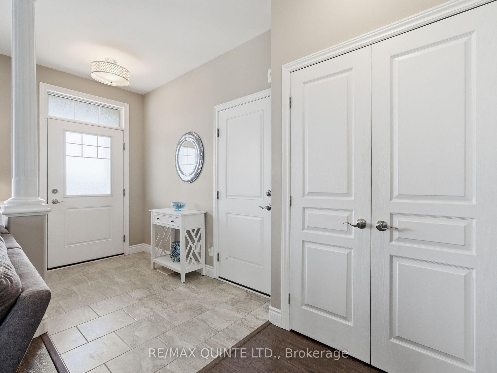 Spacious foyer with garage access and coat closet.