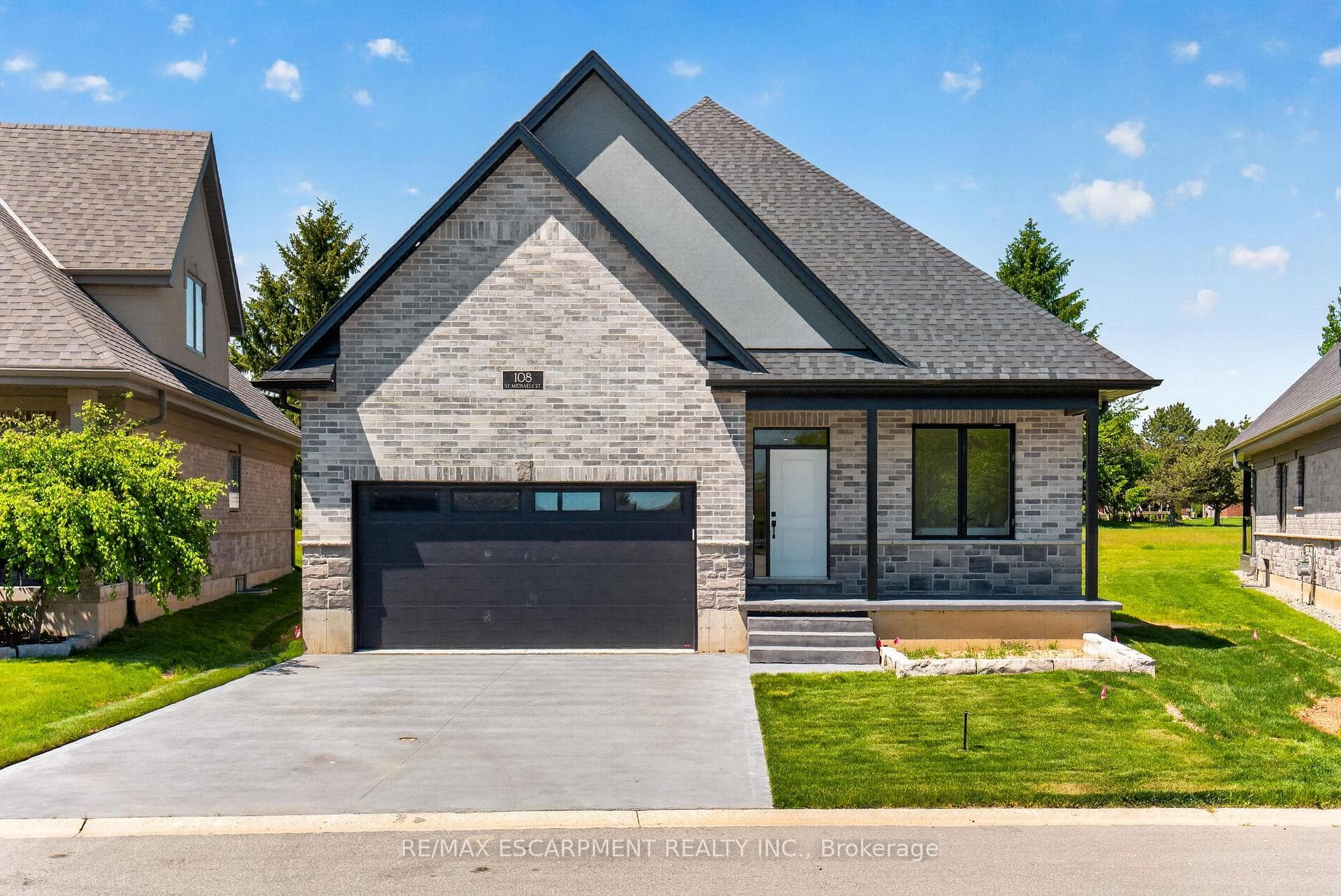 Brand new home with pattern coloured driveway