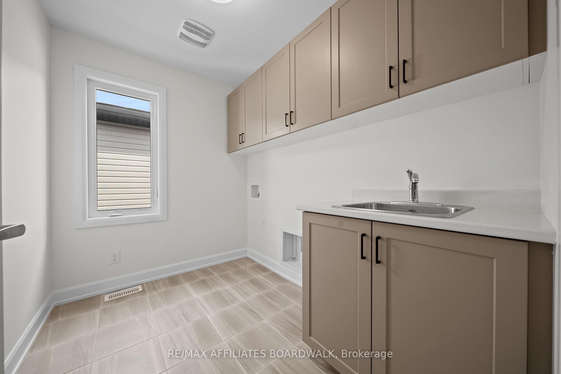 2nd Level laundry with upgraded cabinetry