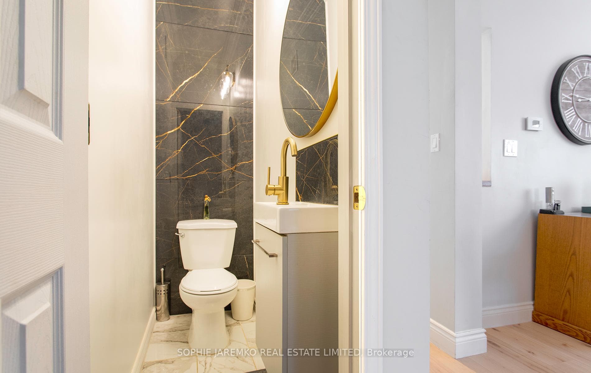 Discrete main floor powder room.