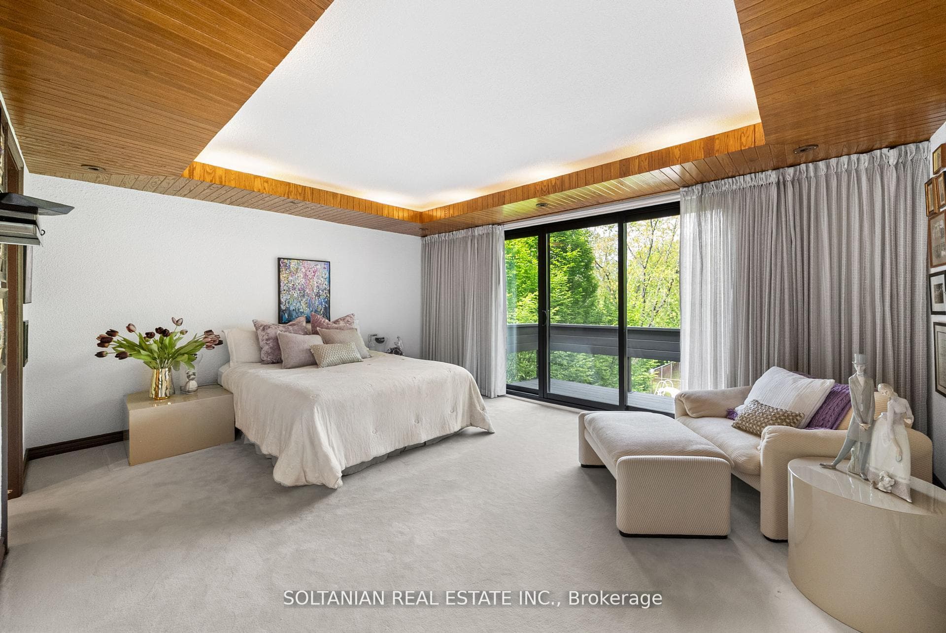 Prime bedroom with balcony overlooking yard
