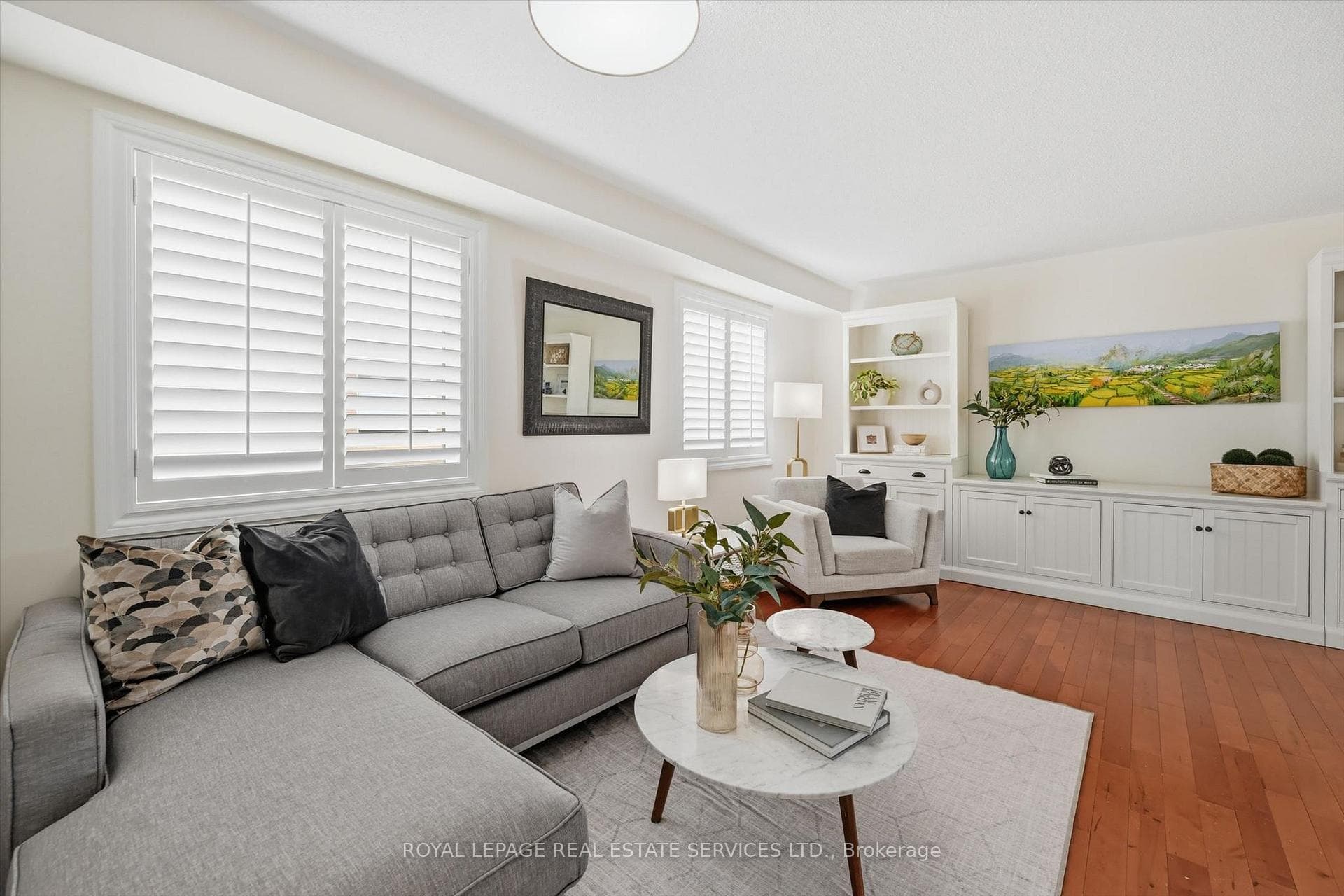 Spacious Living Room Boasts California Shutters