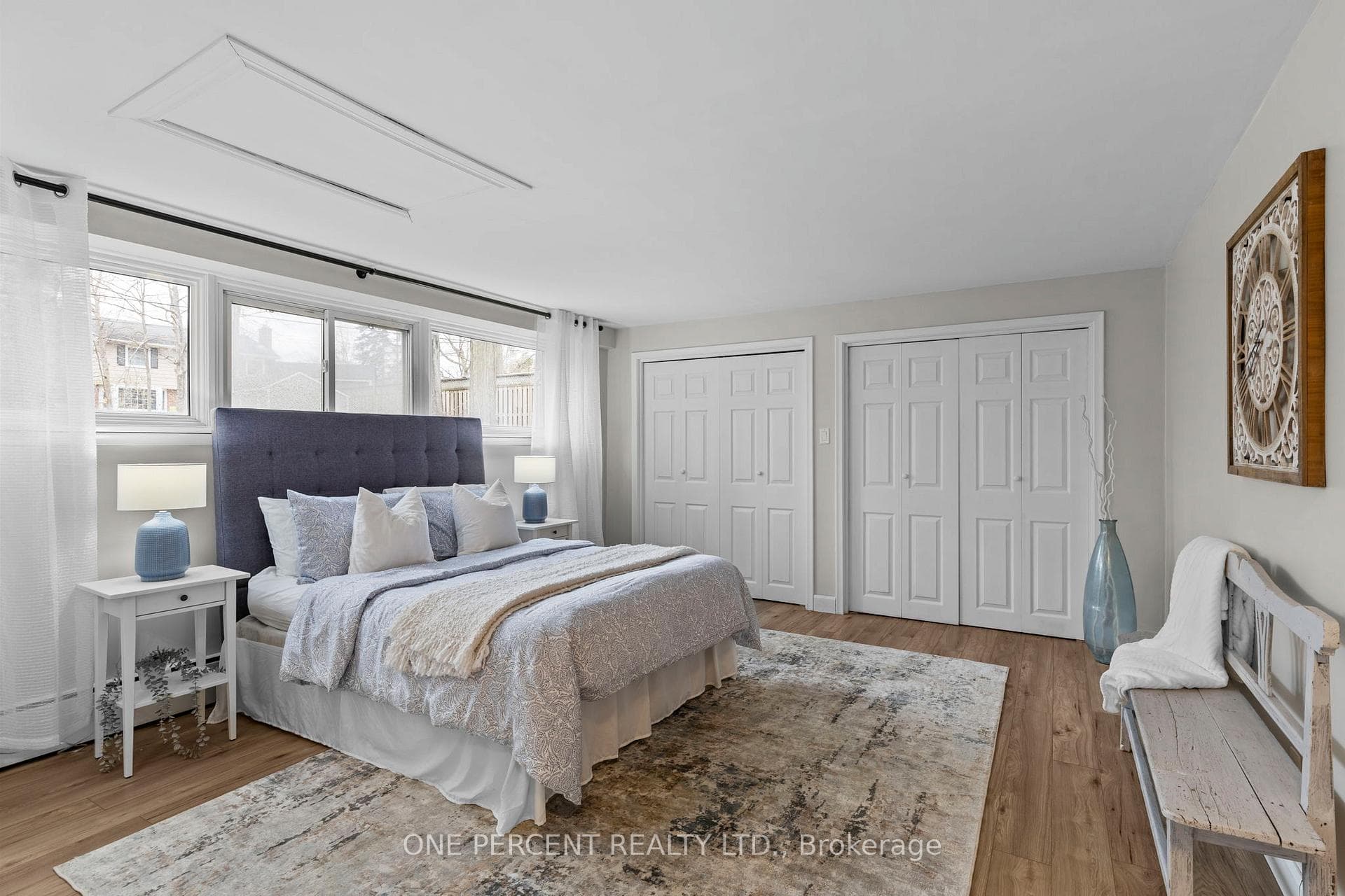Oversized primary bedroom with large windows