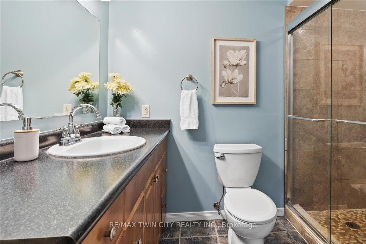 Basement bathroom has large glass shower