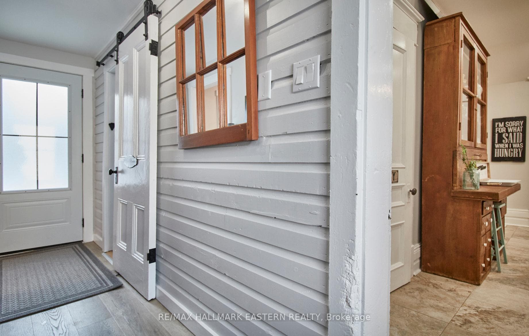 backdoor to fenced west yard, powder room, kitchen