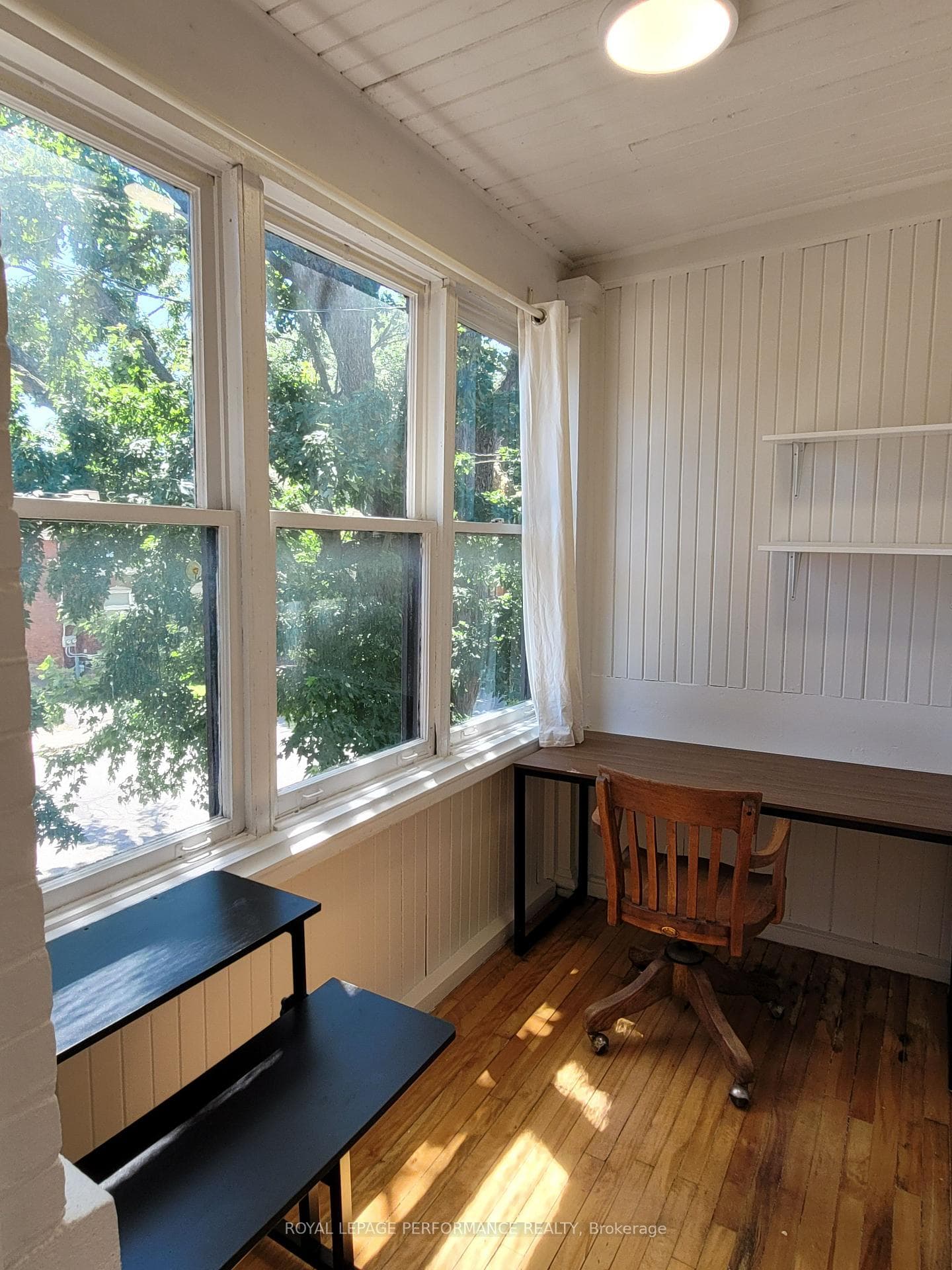 Small room off the bedroom with lots of windows