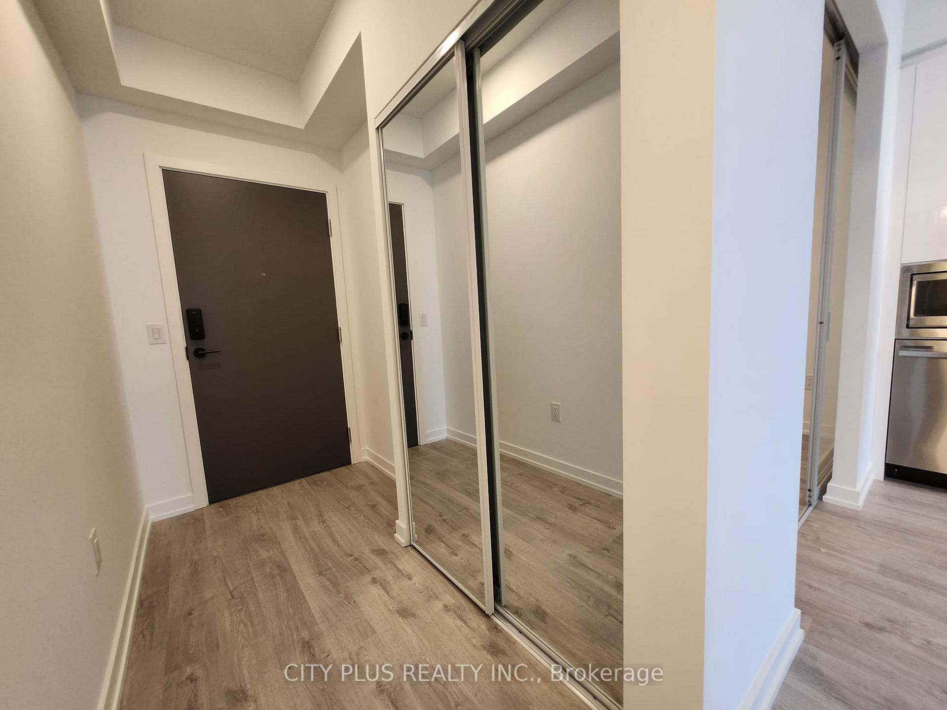Foyer with Mirrored Coat Closet
