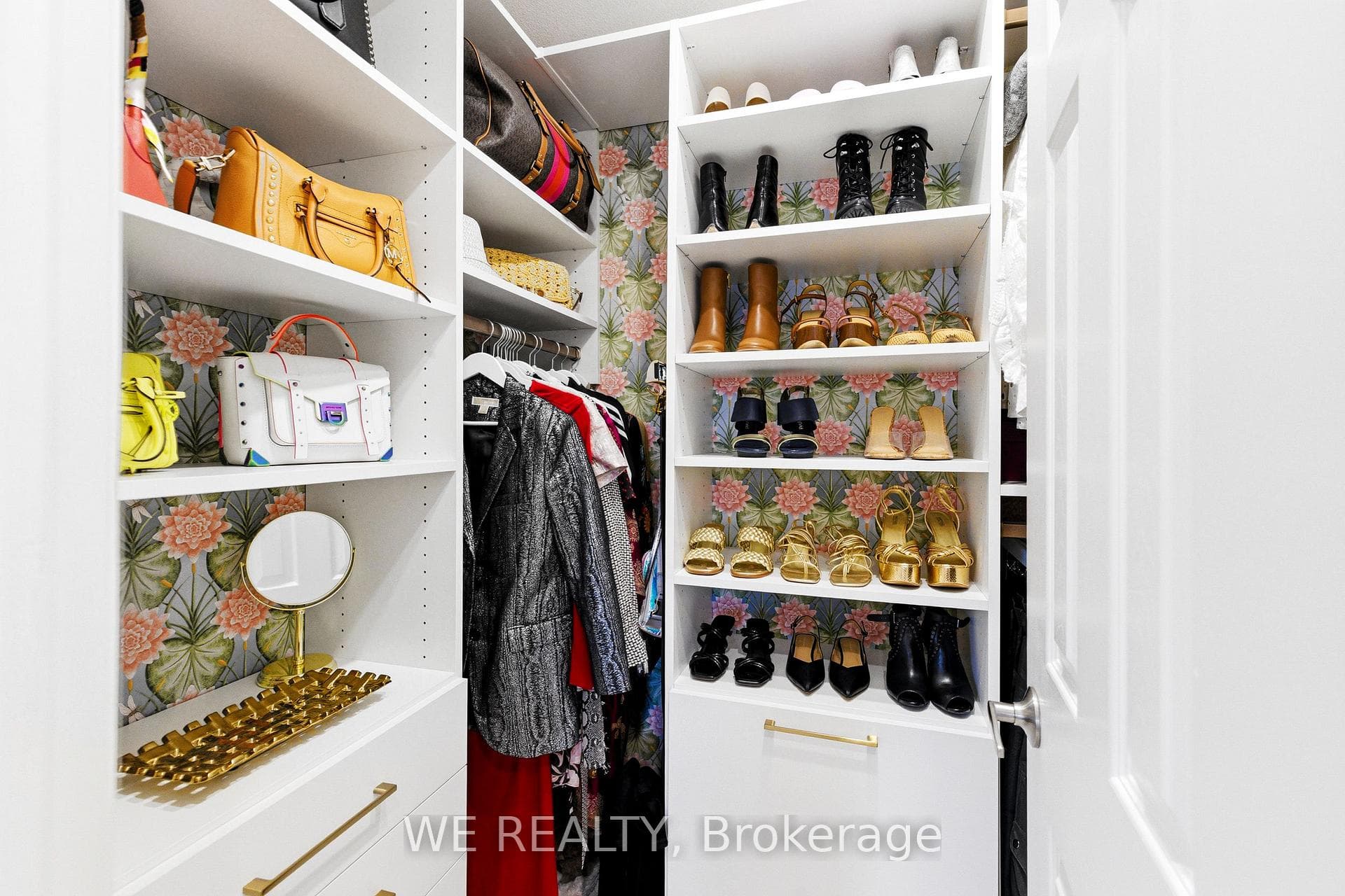 Large Walk-In Closet With Custom Built Ins