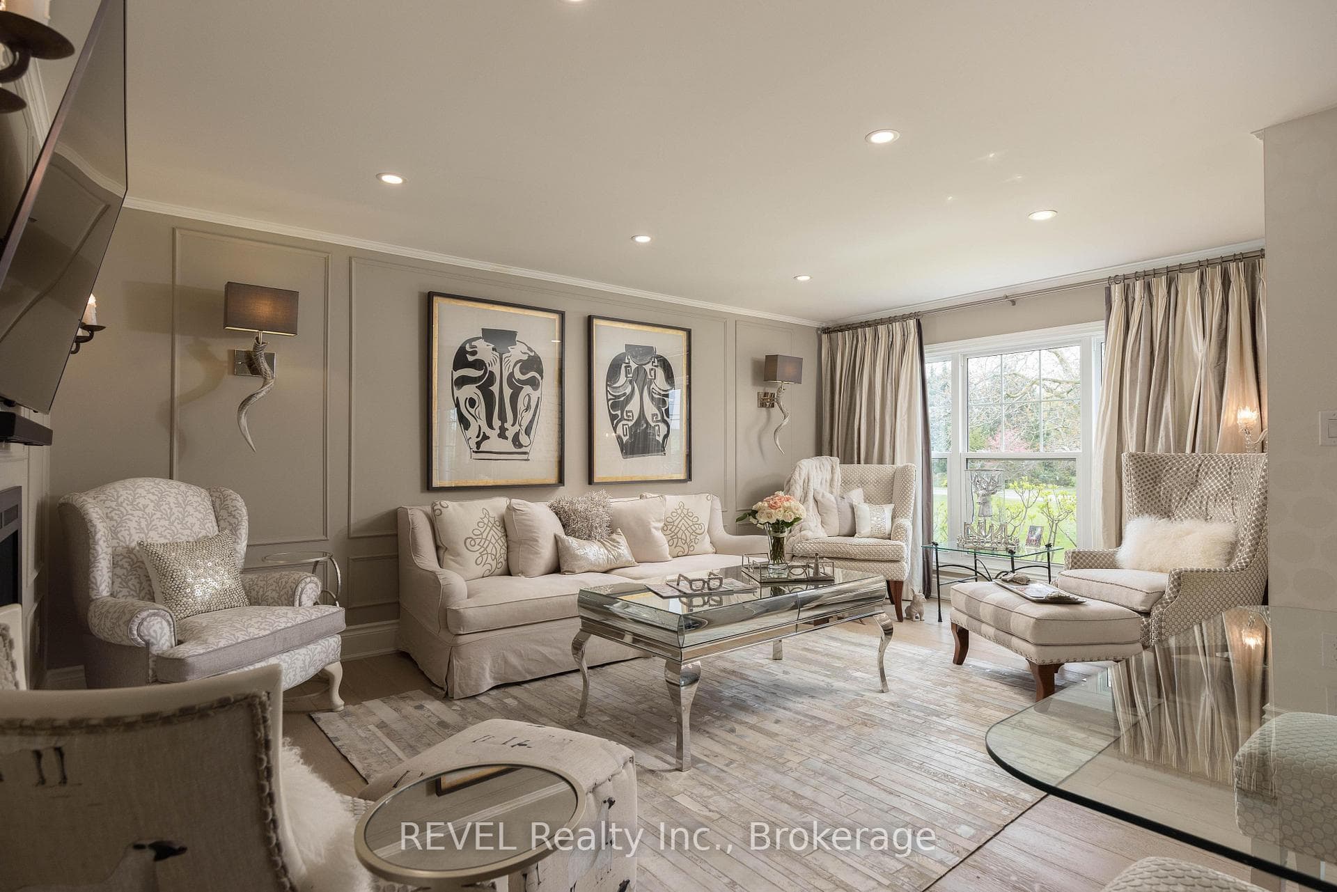 Ceiling pot lights and hardwood flooring.