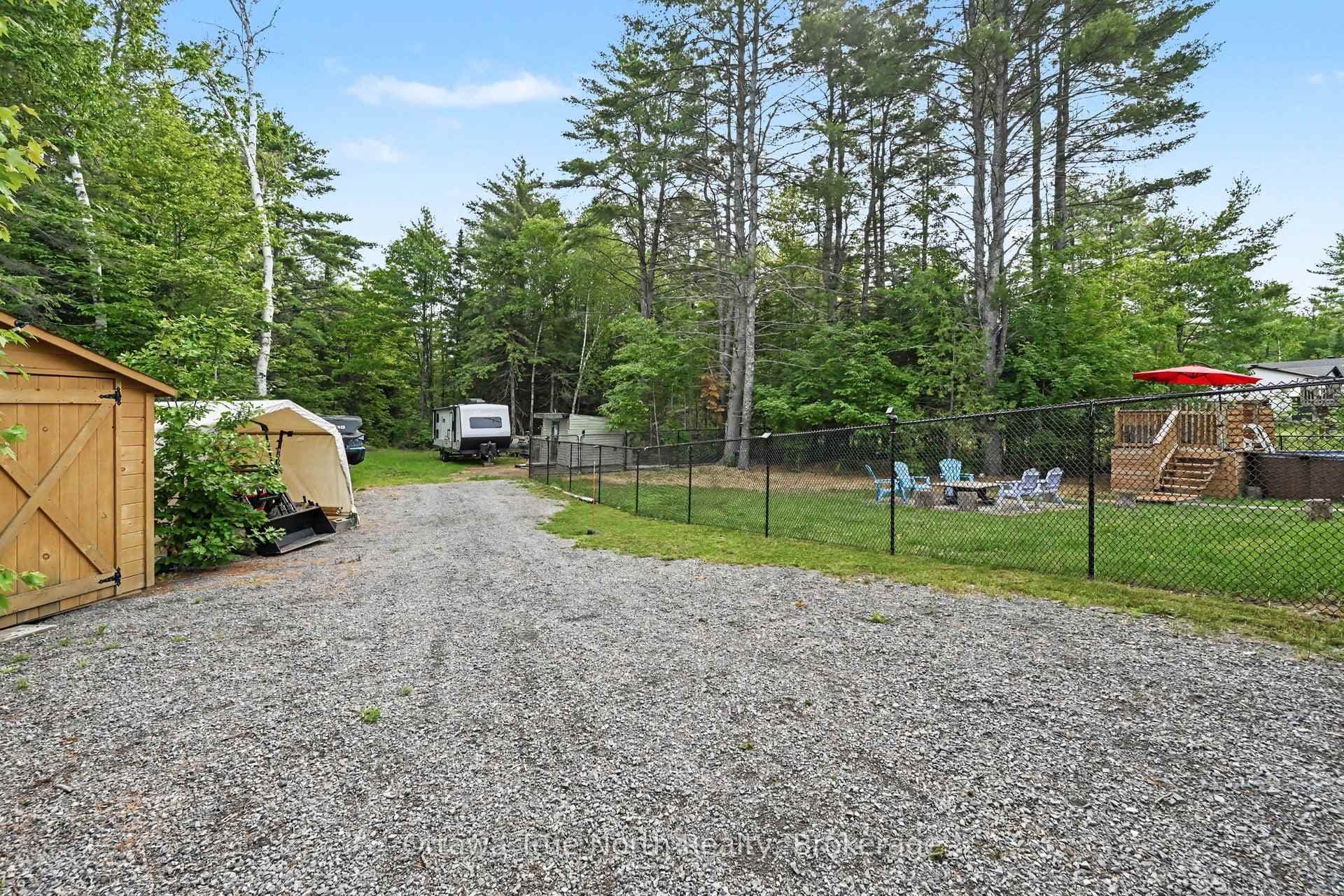 Driveway down side of house