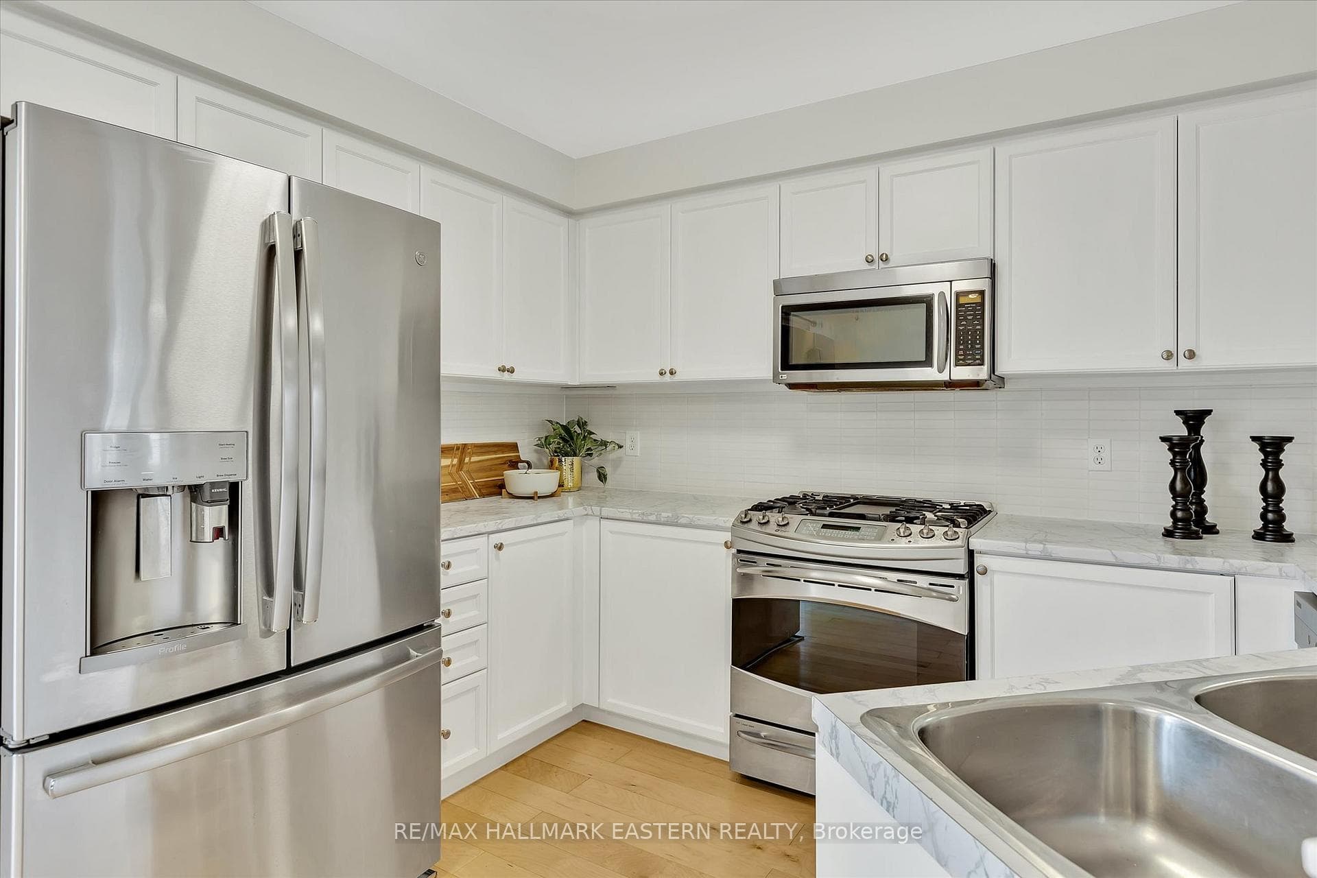 Gas stove with built in microwave
