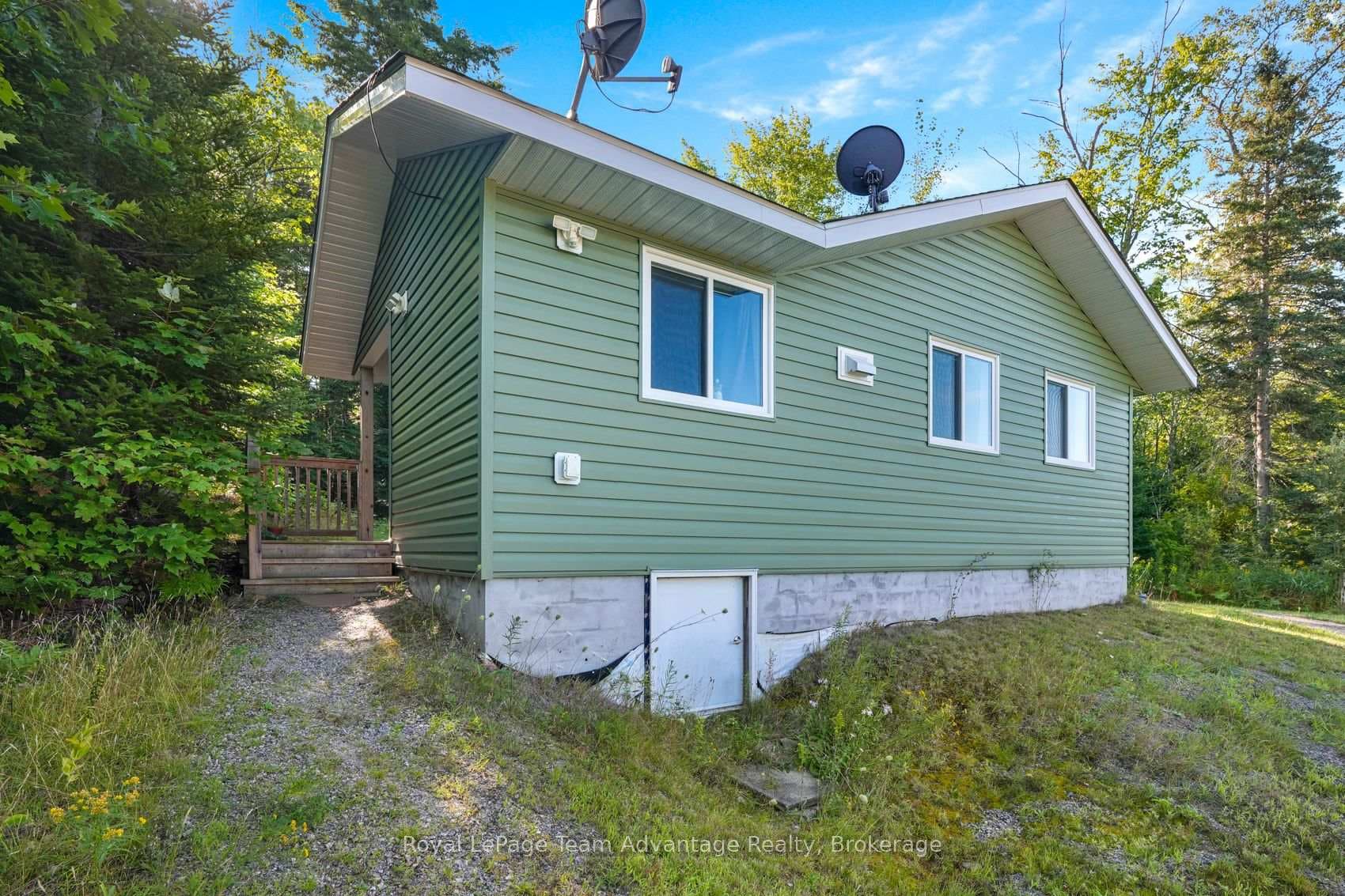 Side of House with View of Deck