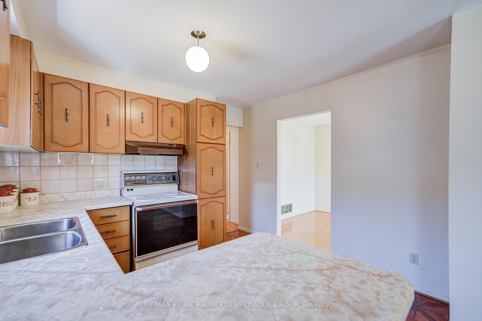 Upper level kitchen with view into dining room