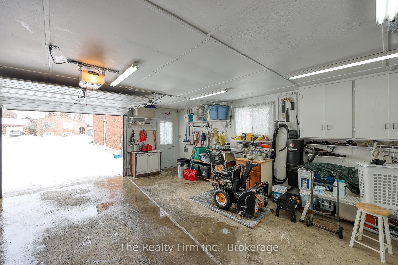 1.5 Car Garage with B/I cabinetry
