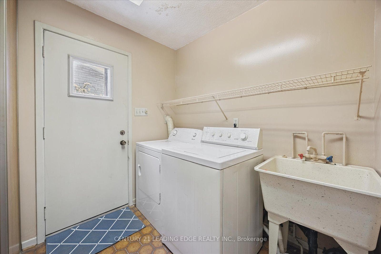 Laundry Room W/O to Side-yard and Garage