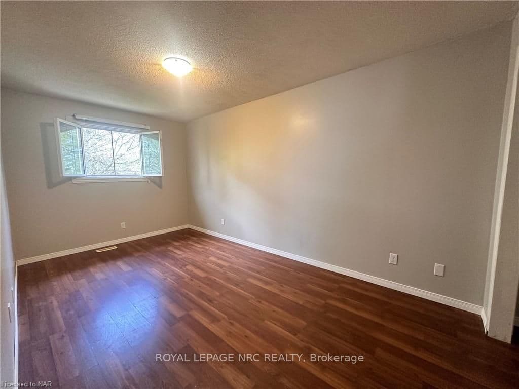 The good sized primary bedroom is at the back of t