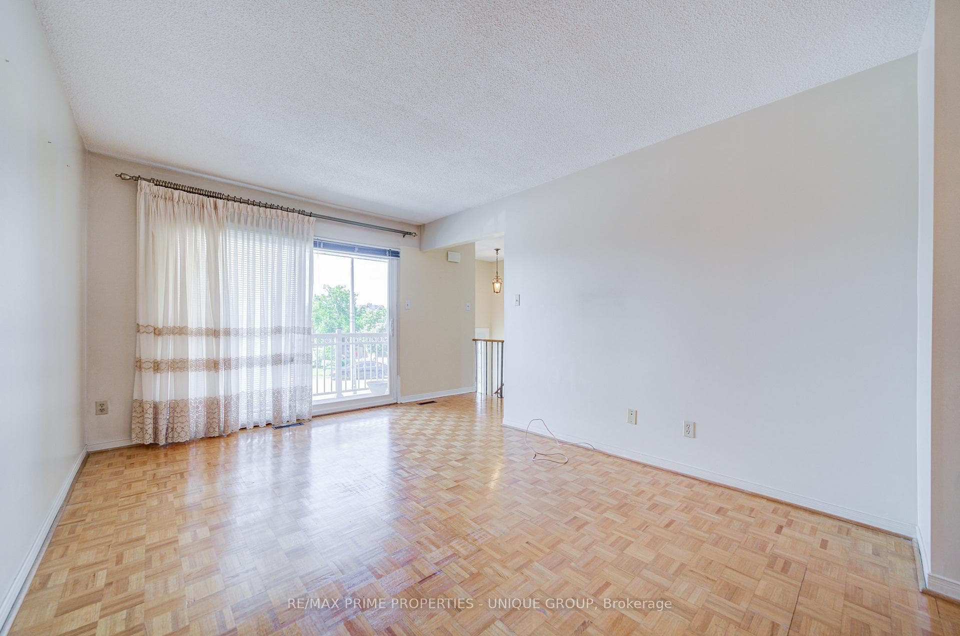 Living room with sliding glass doors to balcony.