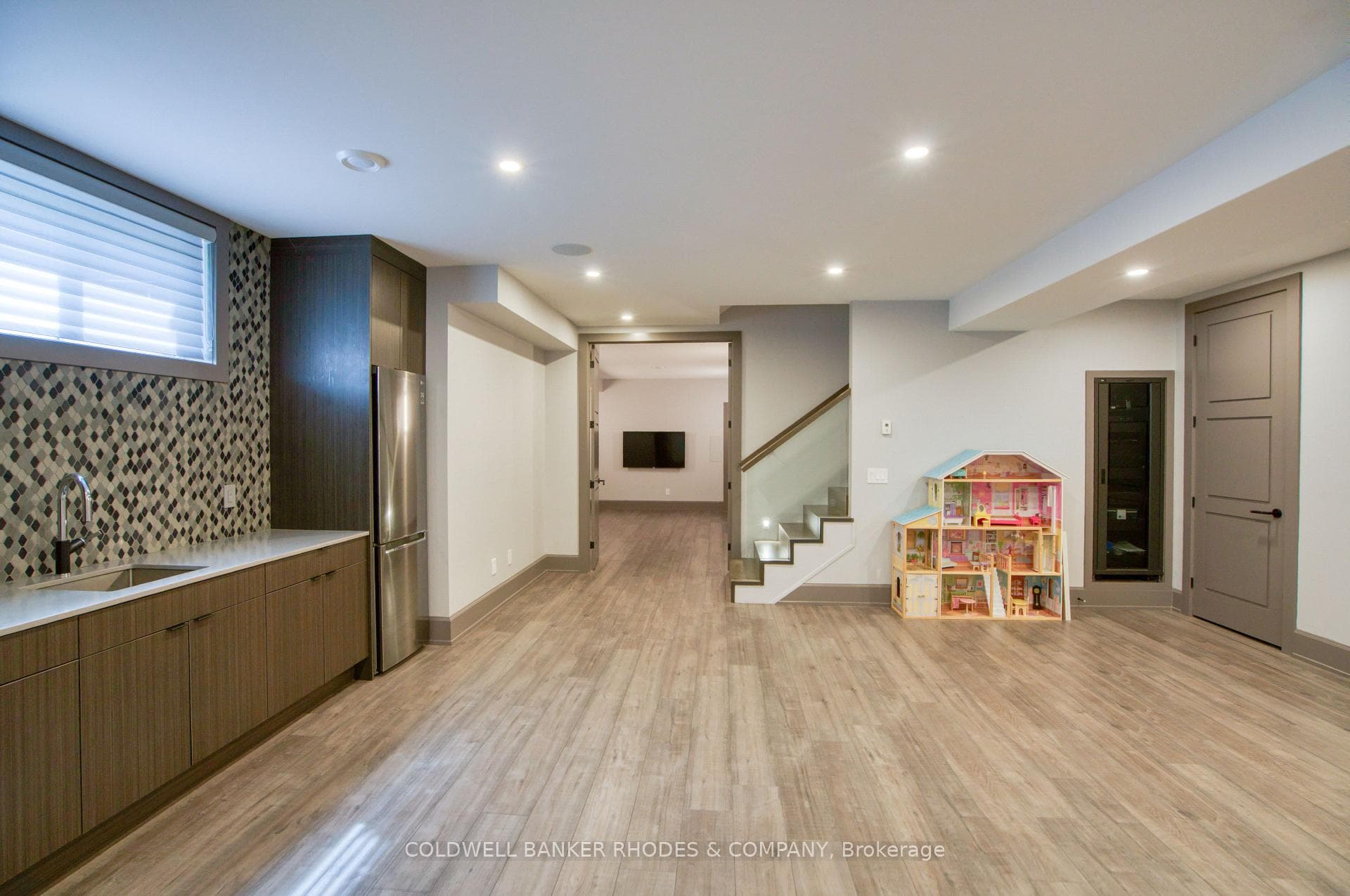 Kitchenette w/fridge and sink plus custom cabinets