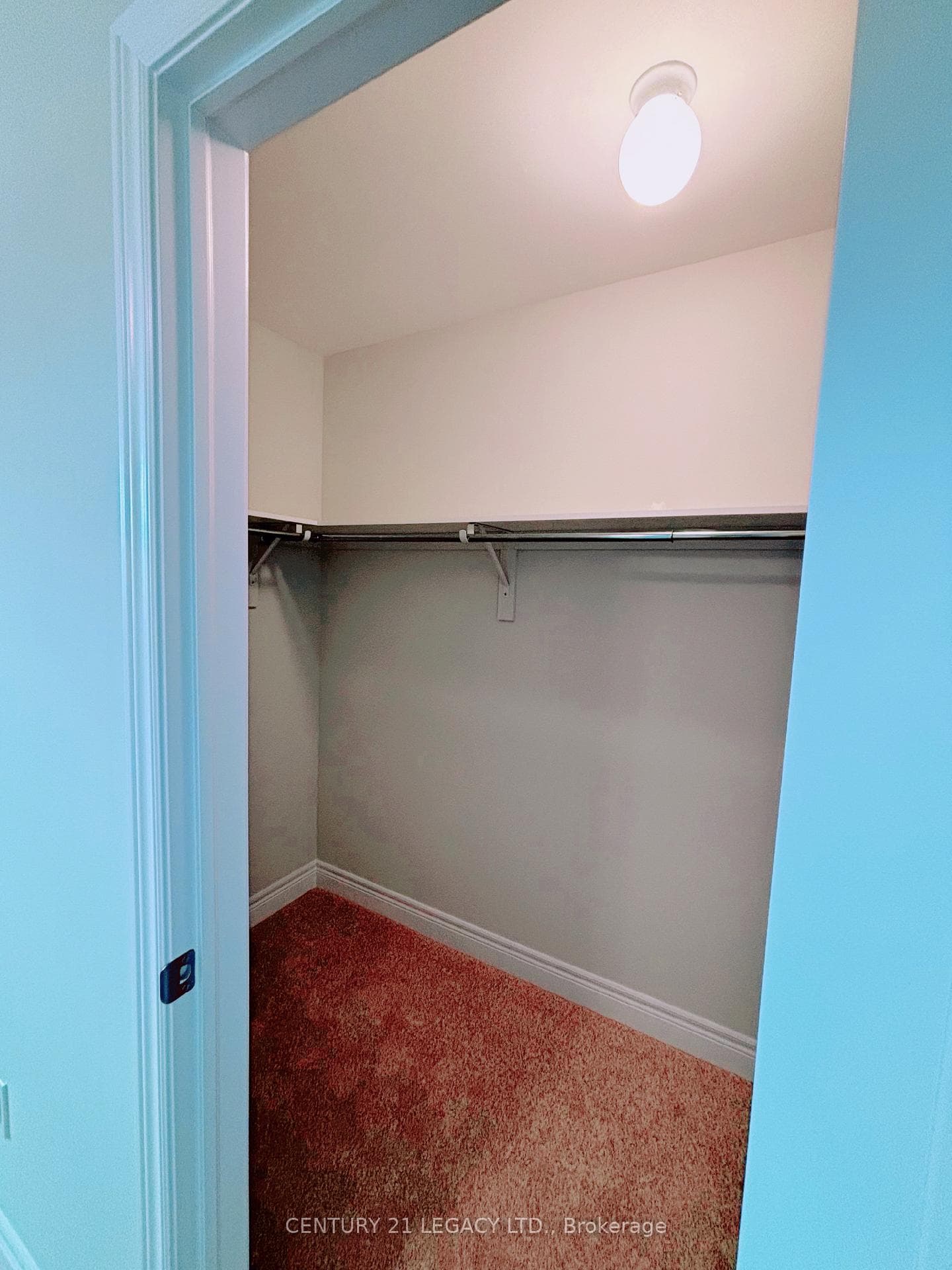 Primary bedroom walk in closet